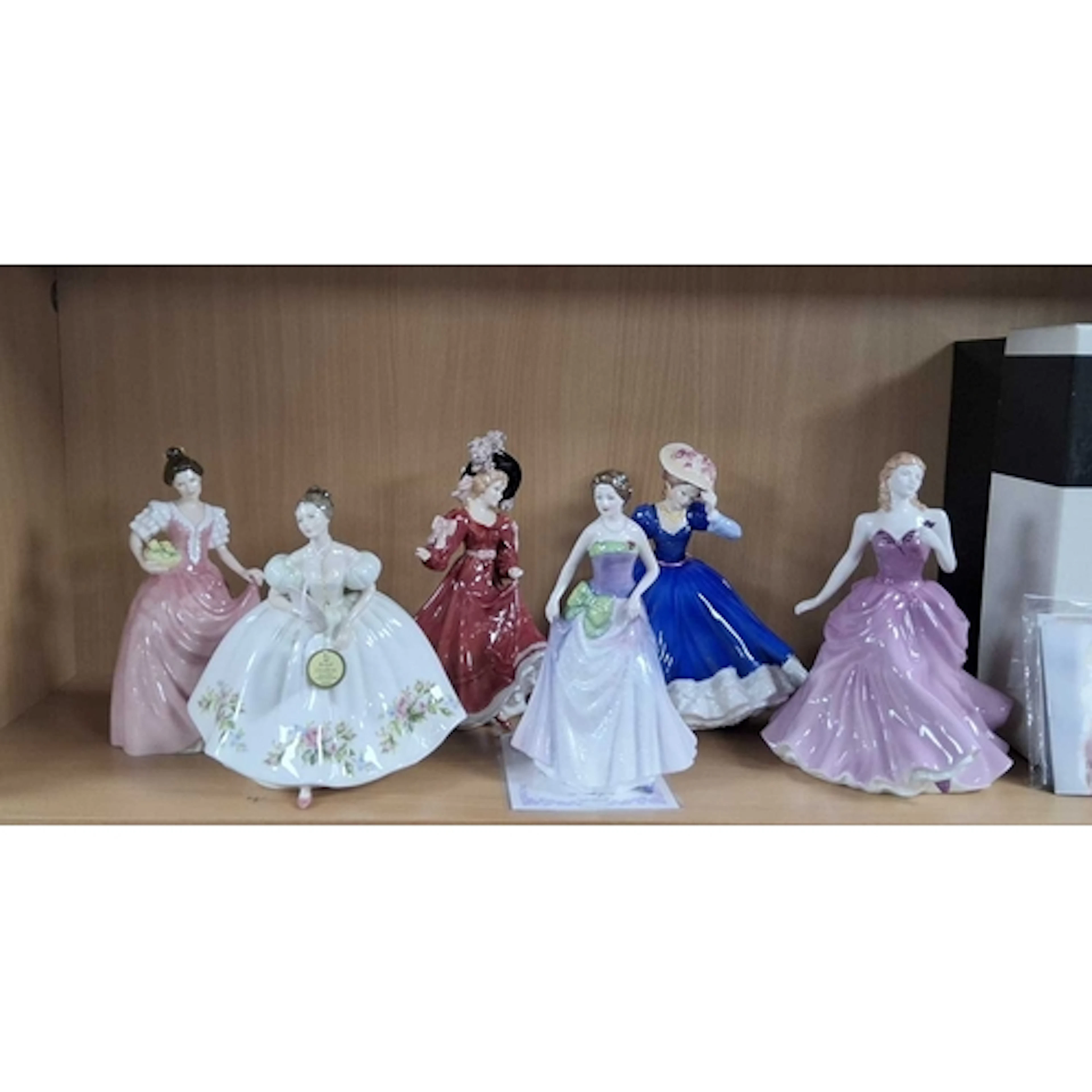 A GROUP OF SIX ROYAL DOULTON LADY FIGURINES, comprising 'Vic...