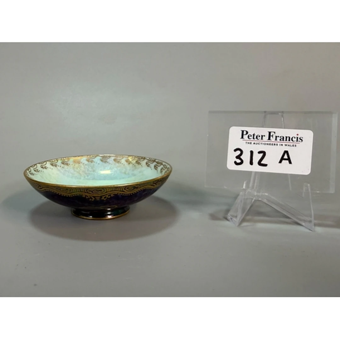 Wedgwood Fairyland Lustre bowl depicting stylised bird motif...