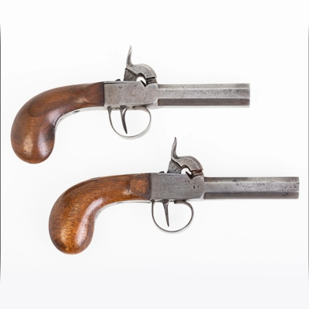 CASED PAIR OF PERCUSSION CAP POCKET PISTOLS. Cased pair of p...