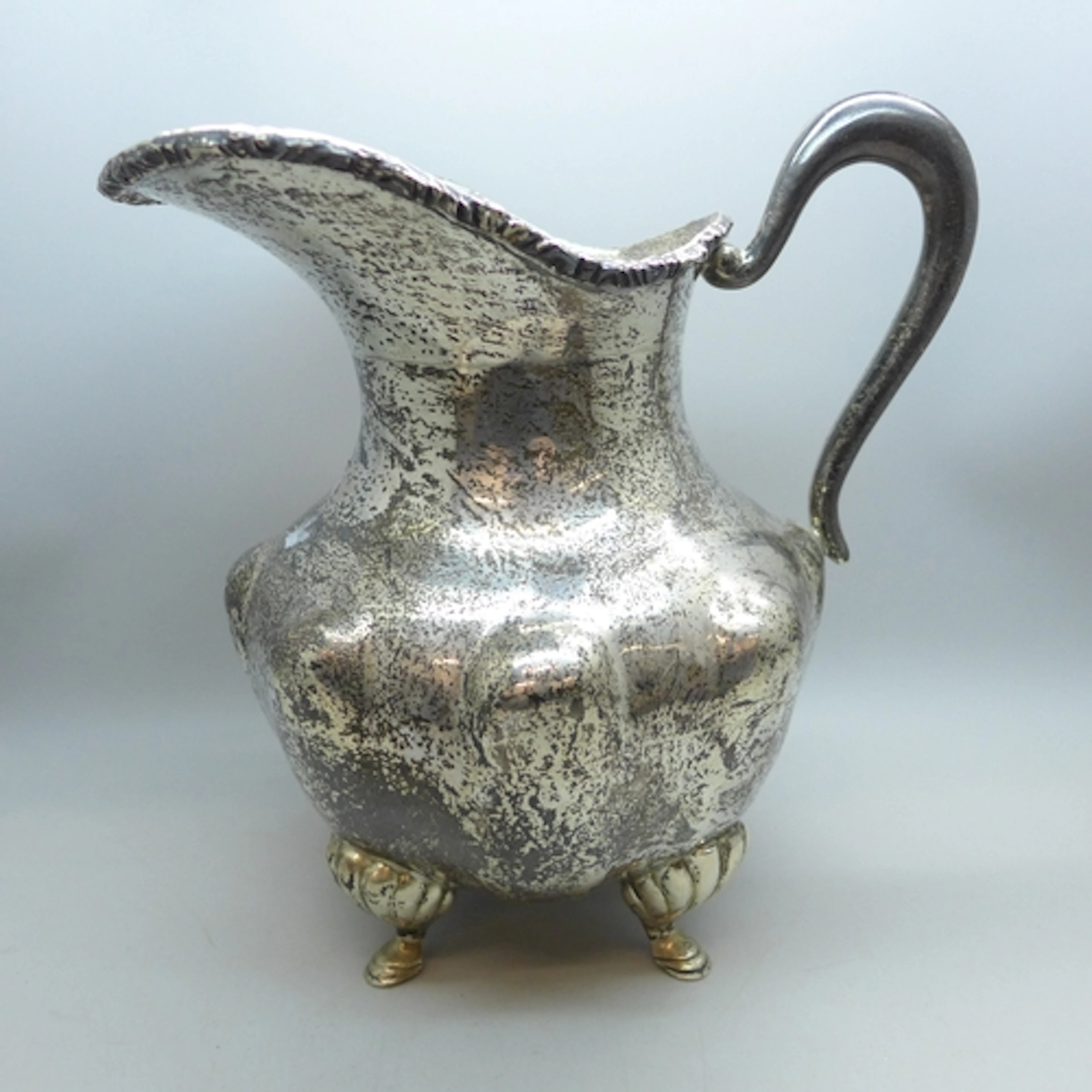 A Mexican sterling silver jug, 852g, 20.5cm to top of handle