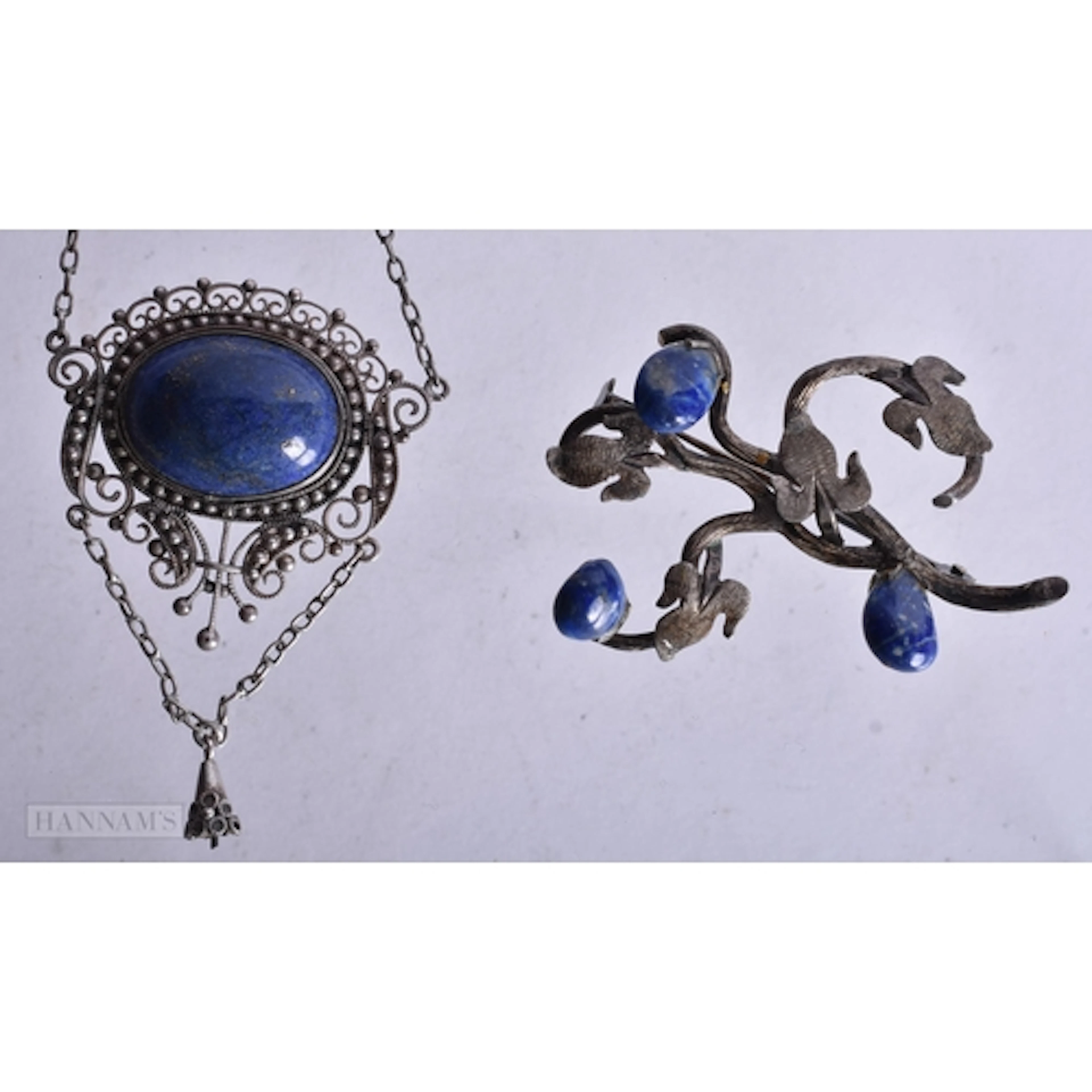 A White Metal and Lapis Pendant Necklace and Brooch. Chain ...