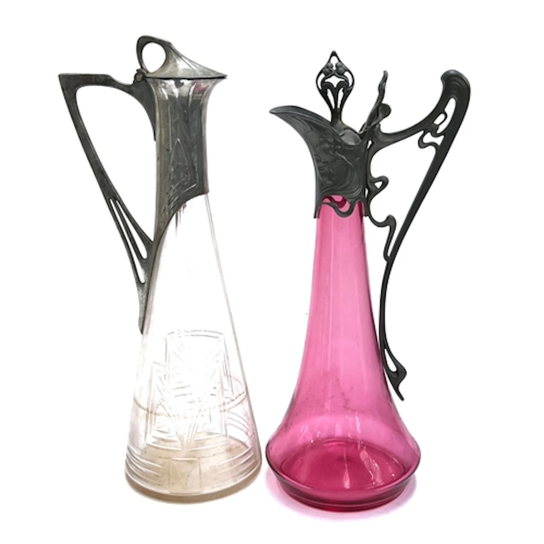 A cut glass and pewter mounted Art Nouveau pitcher, 42cmH; t...