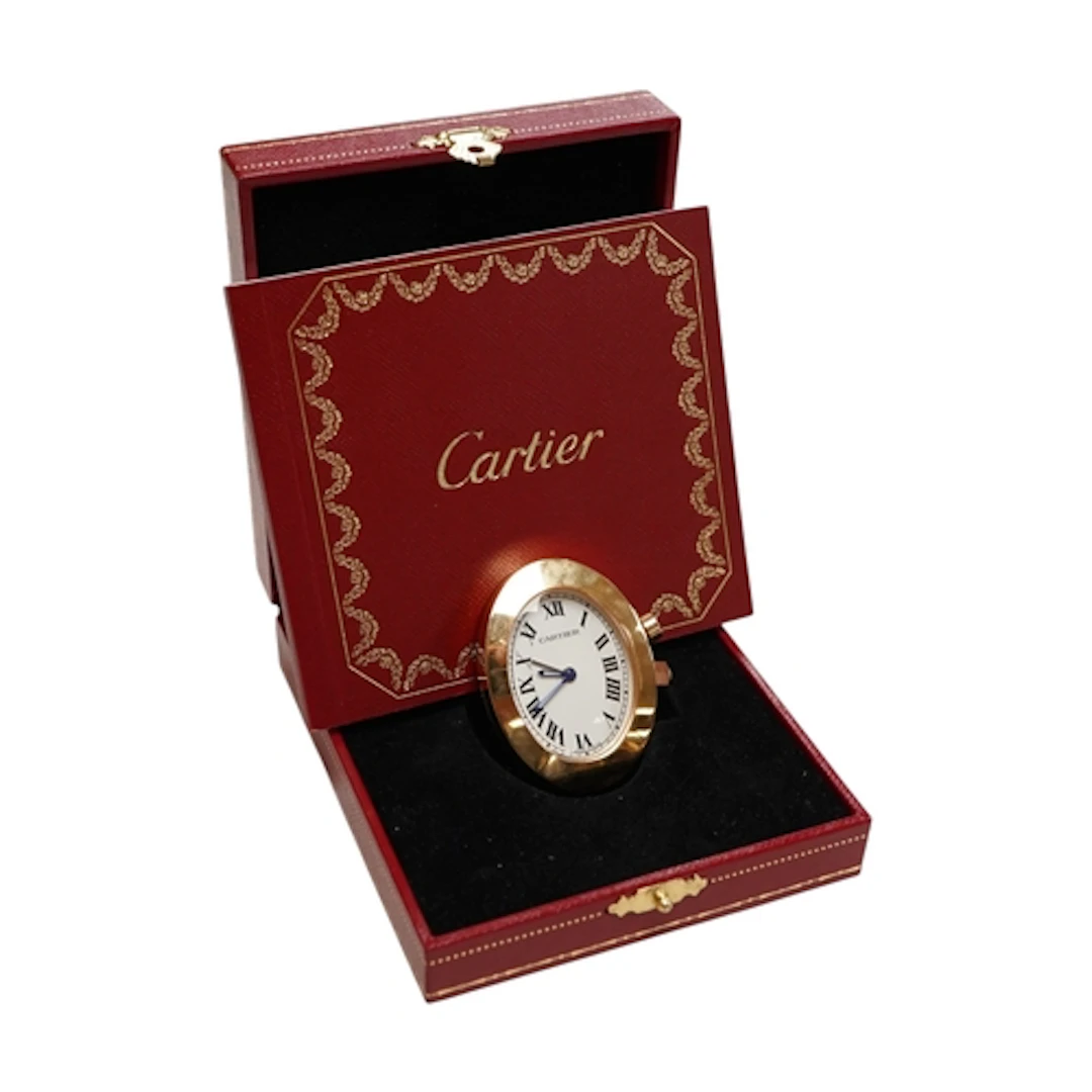 A boxed Cartier travel or desk timepiece, 2752, with booklet...