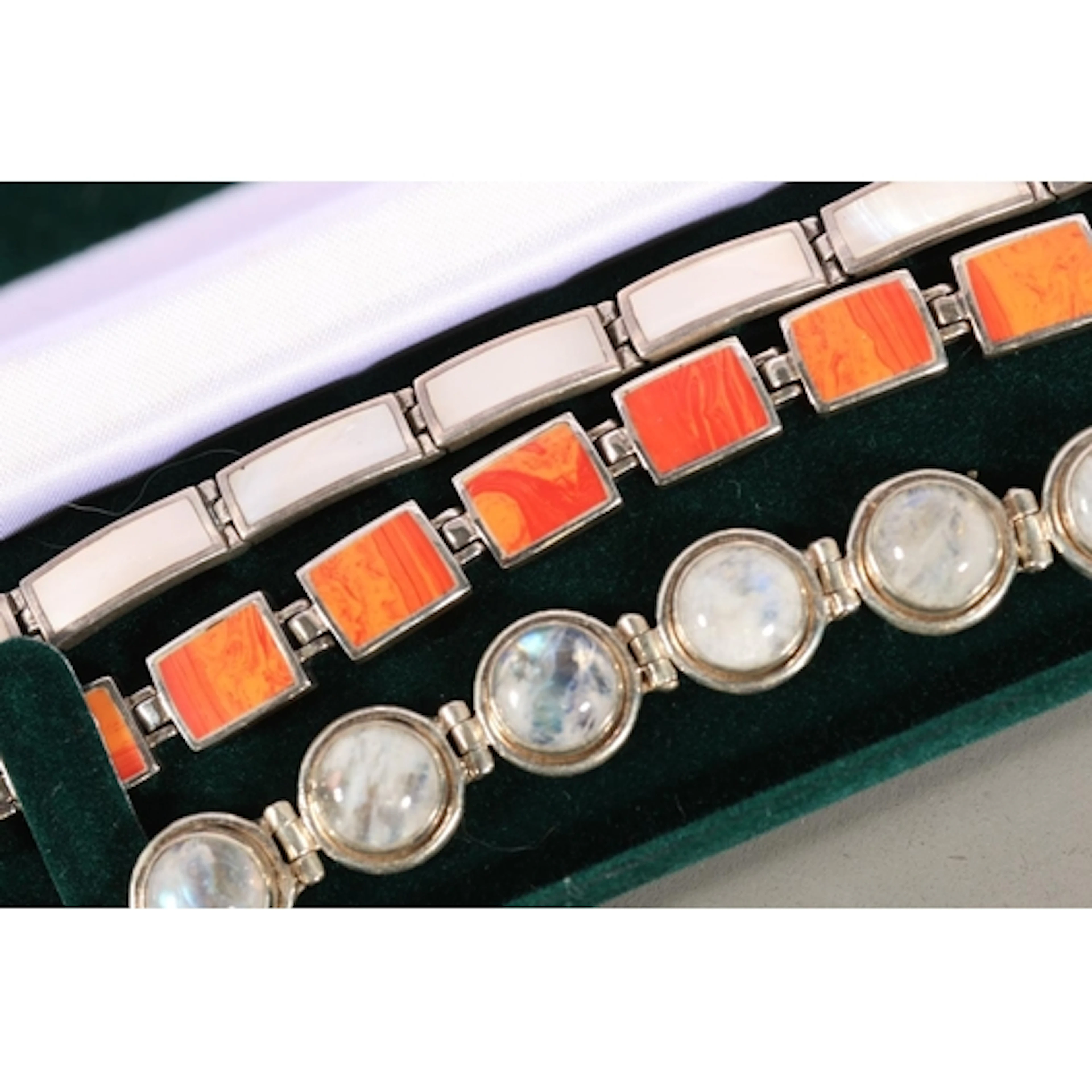 Silver moonstone cabochon bracelet and two others.