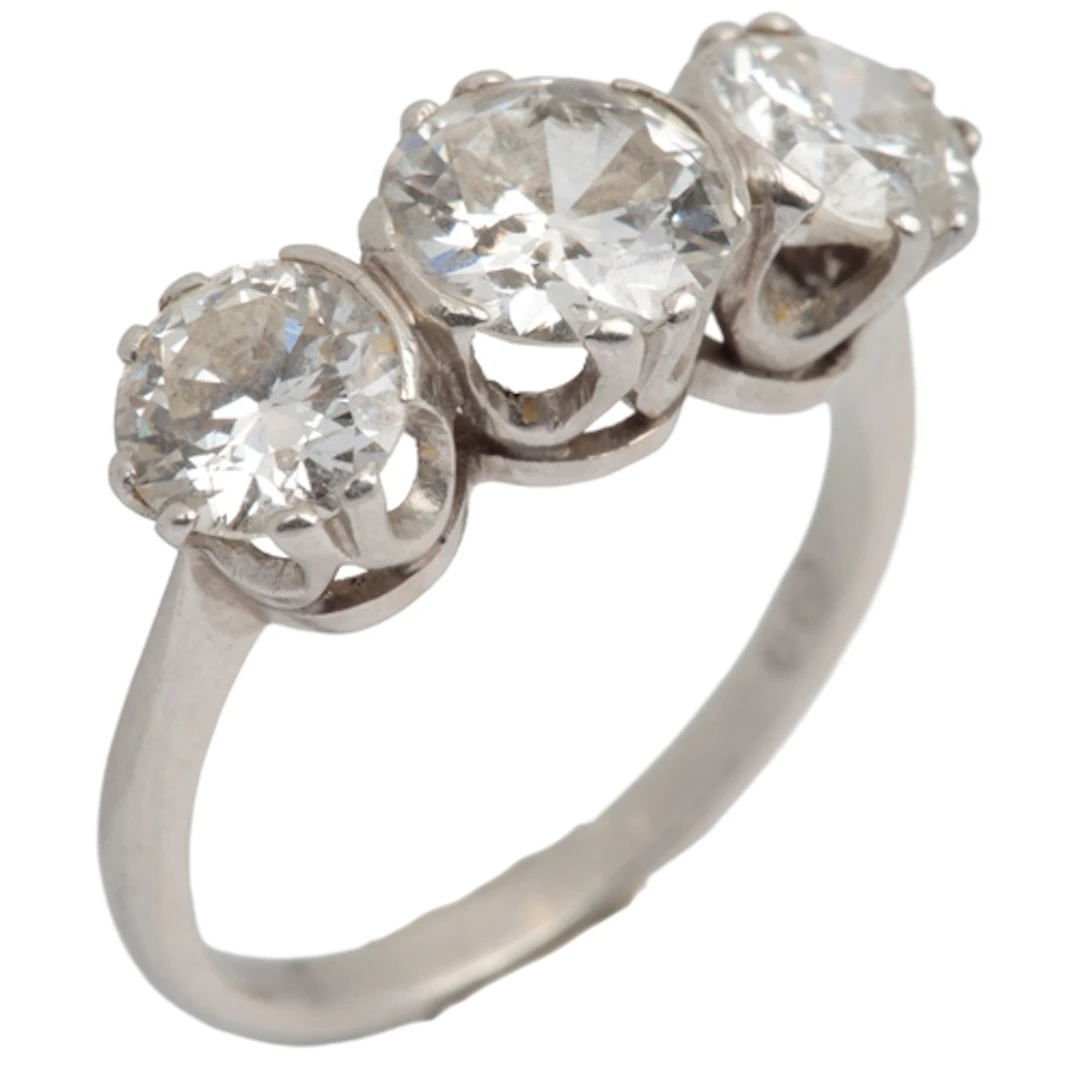 A diamond three-stone ring, Sweden, 1930s, centring on a cir...