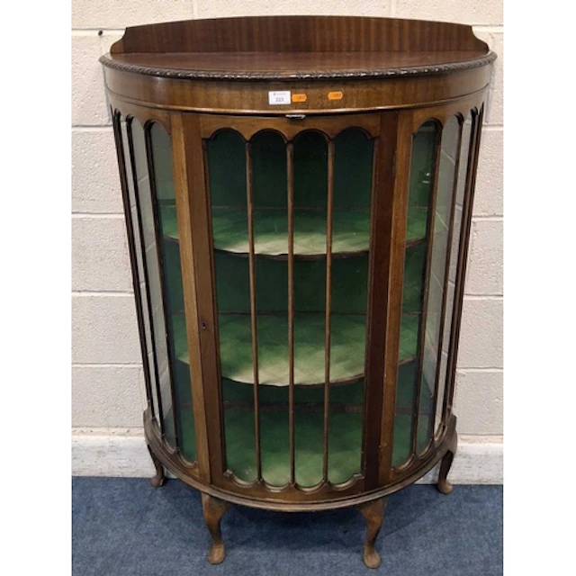 AN EDWARDIAN MAHOGANY DEMI-LUNE DISPLAY CABINET, the single ...