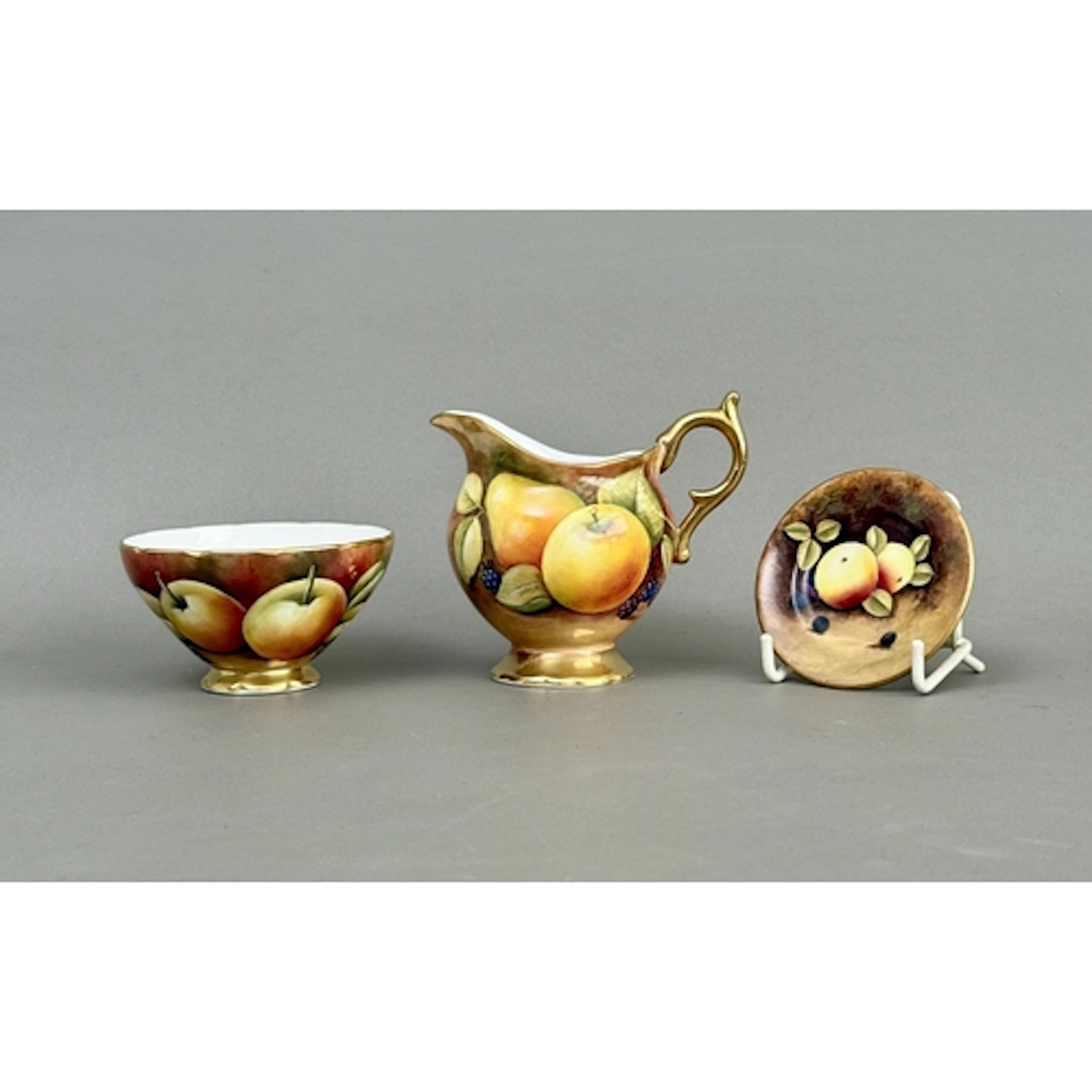 Three pieces of Coalport hand painted fruit pattern bone chi...