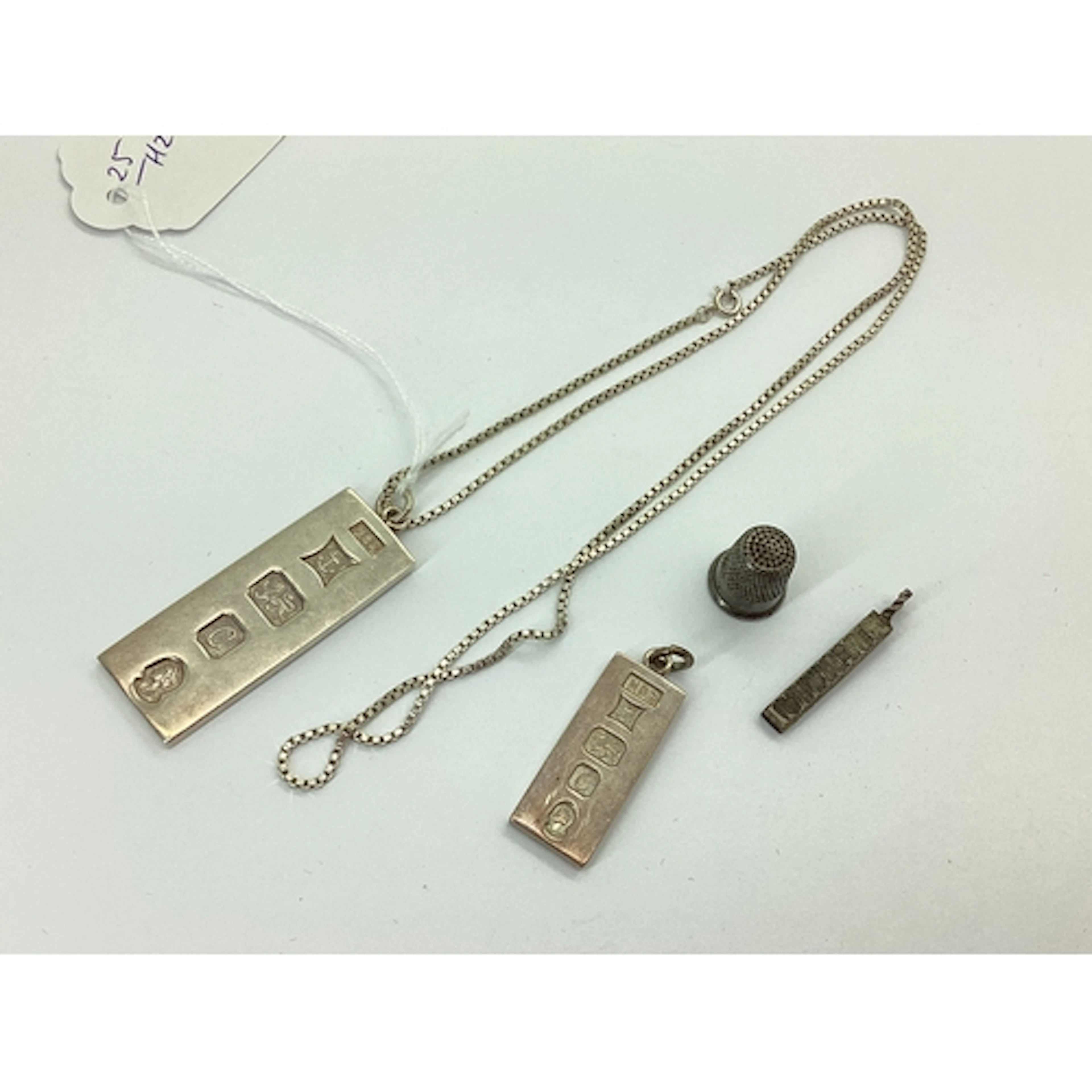 A 1977 Hallmarked Silver Ingot Pendant, suspended on a box l...