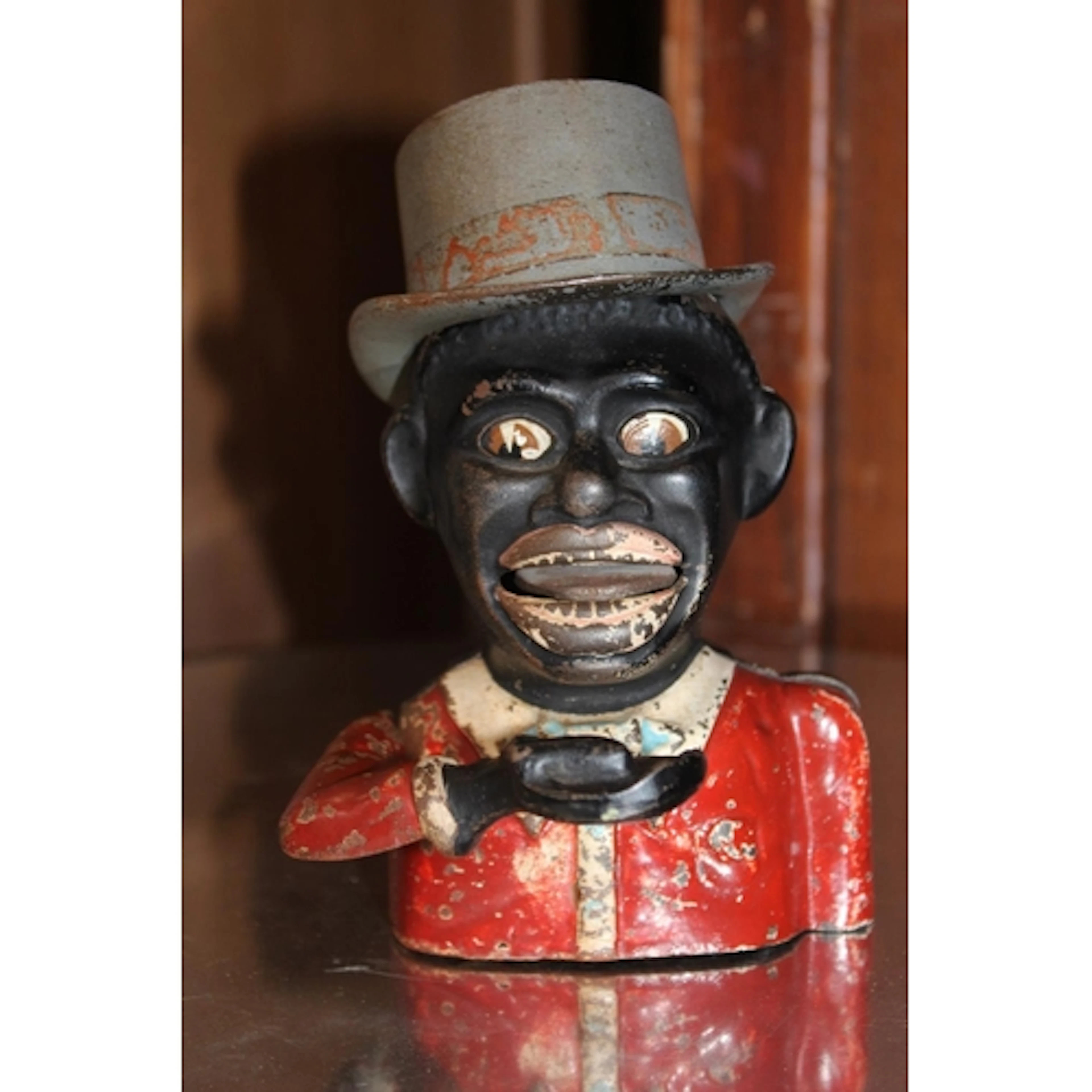 Antique painted cast iron money bank.