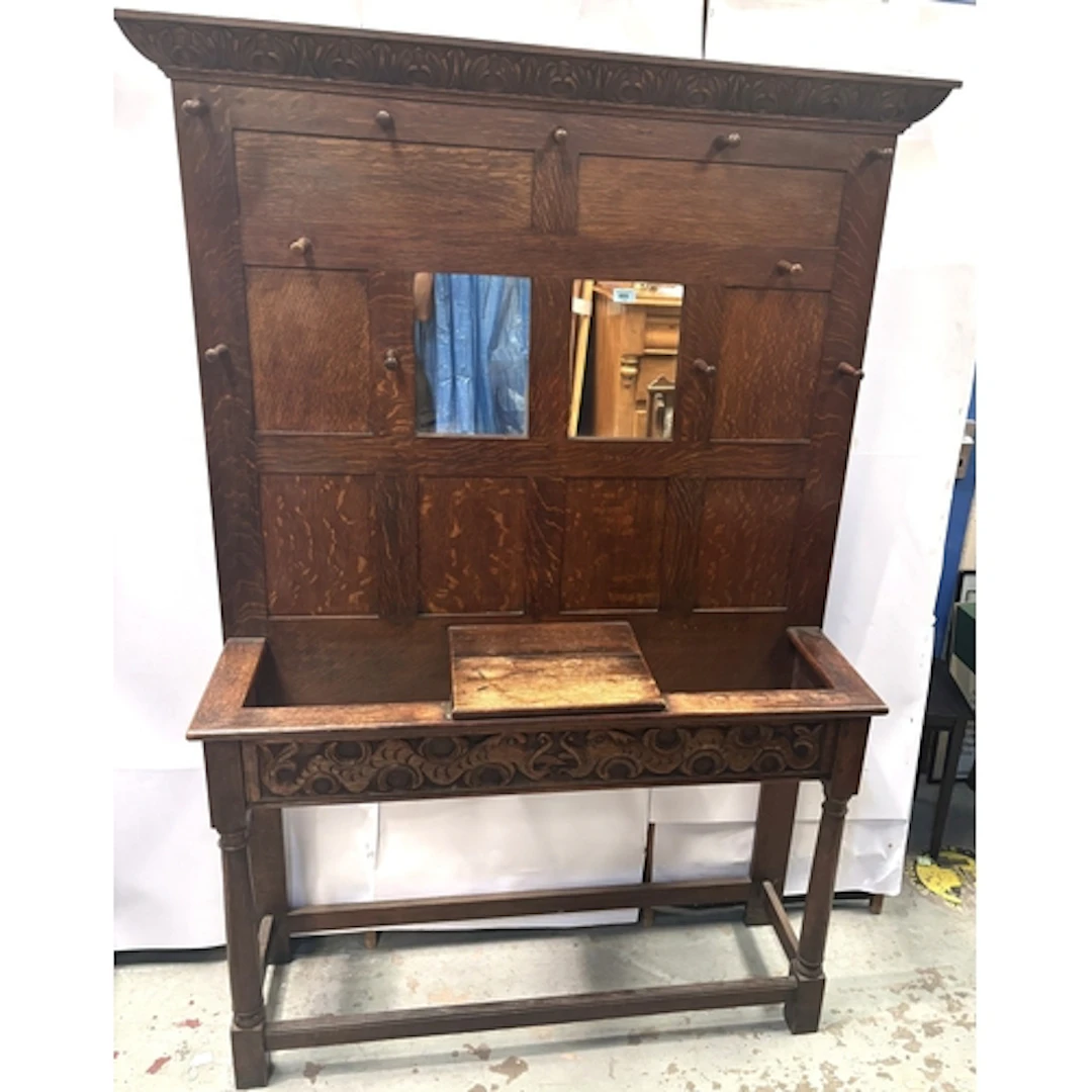 Liberty & Co. oak hall stand with carved mythical fish a...
