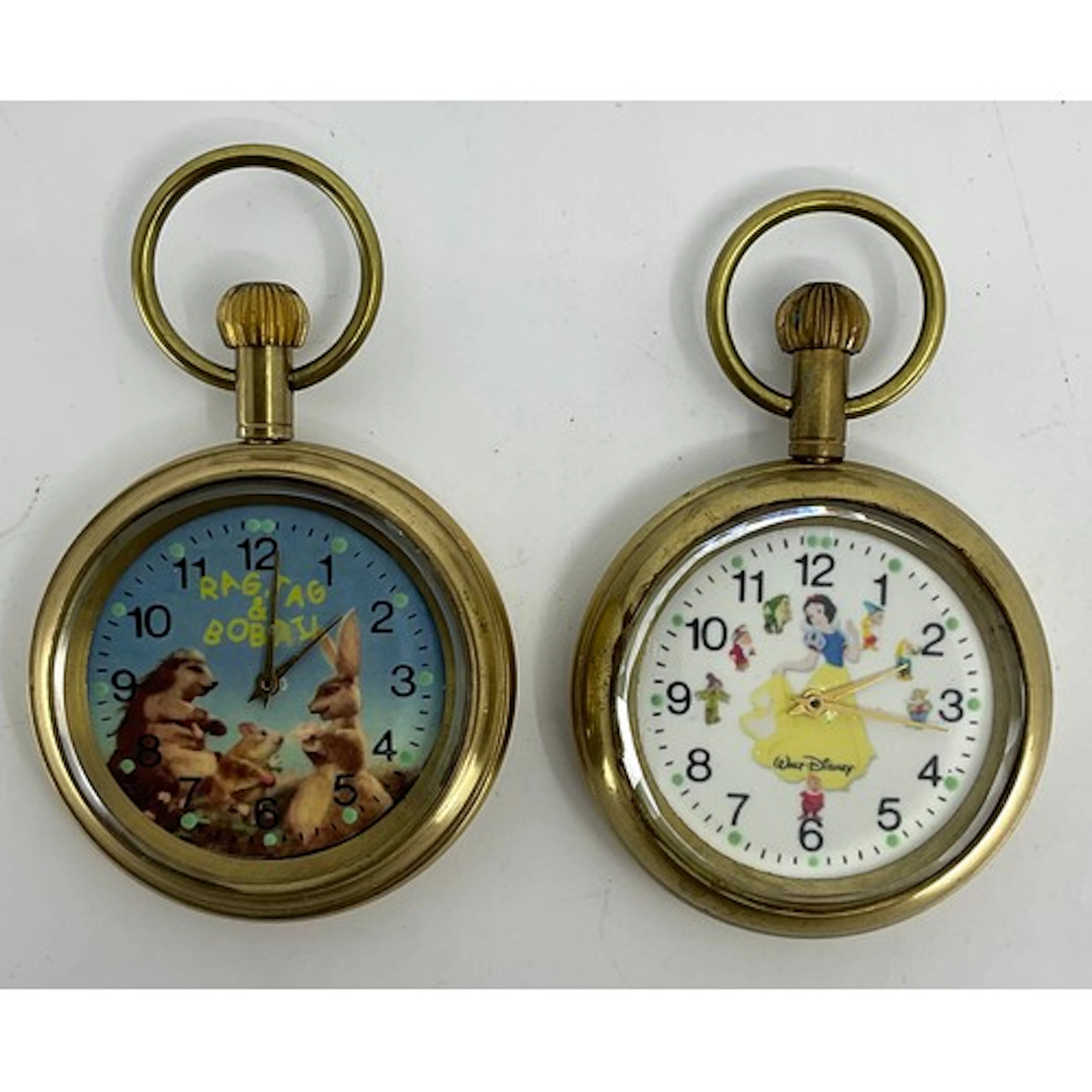 A Walt Disney Snow White novelty pocket watch; another, Rag,...