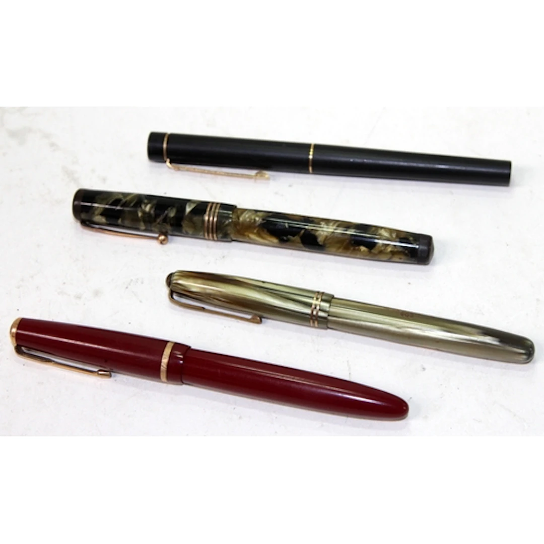 A small collection of quality fountain pens including Marbie...