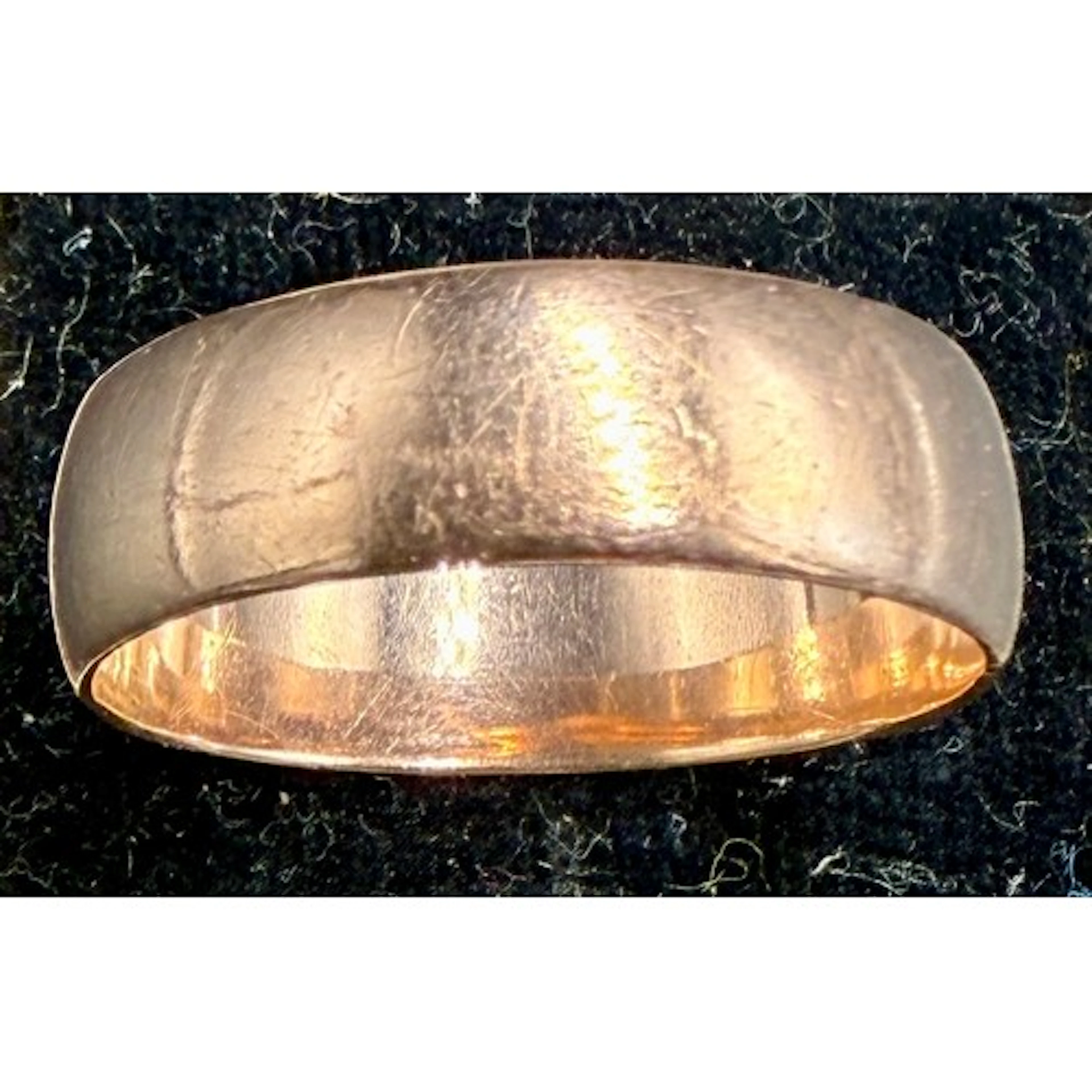 A 9 carat gold wedding band. Size X. Weight 5.3gm.