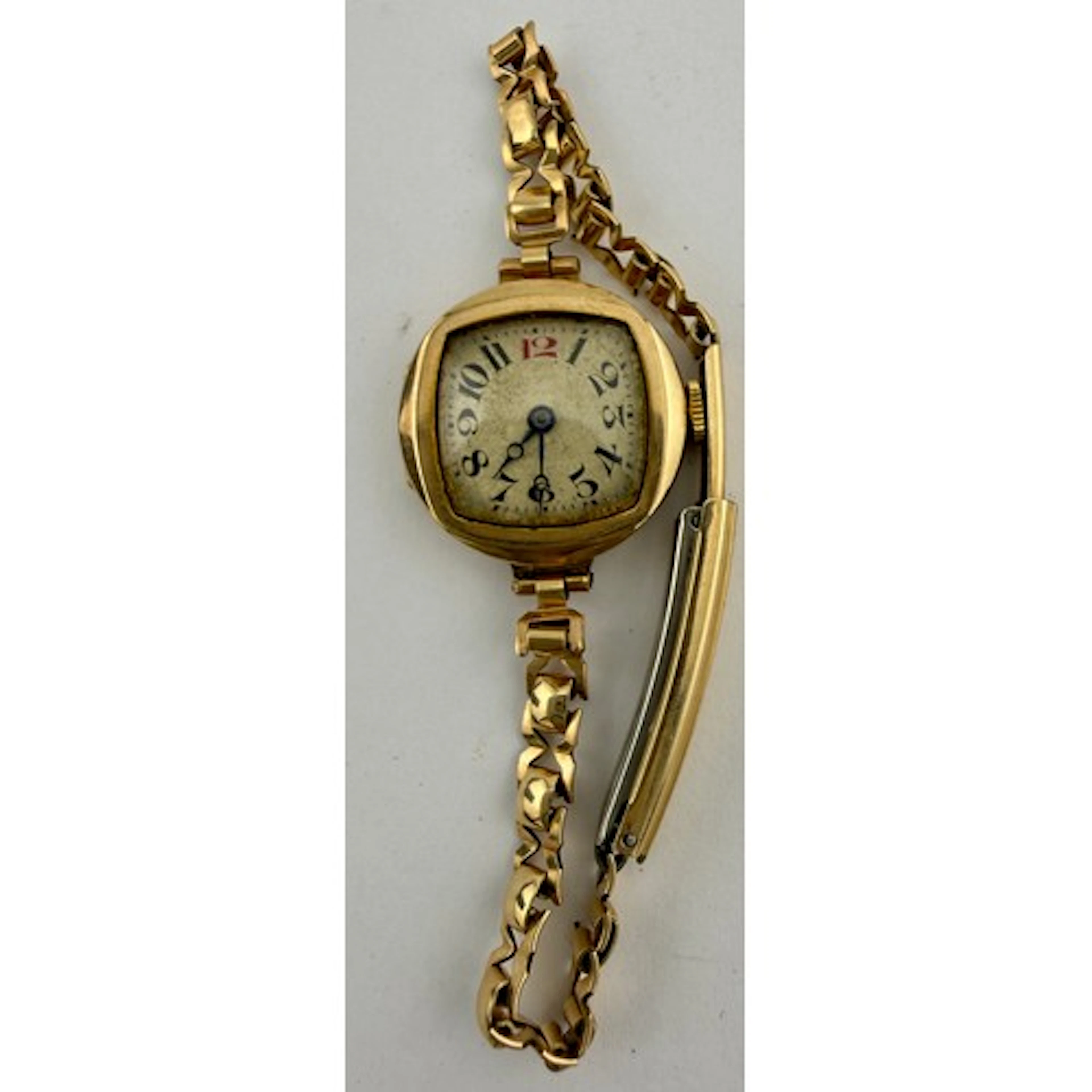 A nine carat gold cased ladies wristwatch on a rolled gold b...