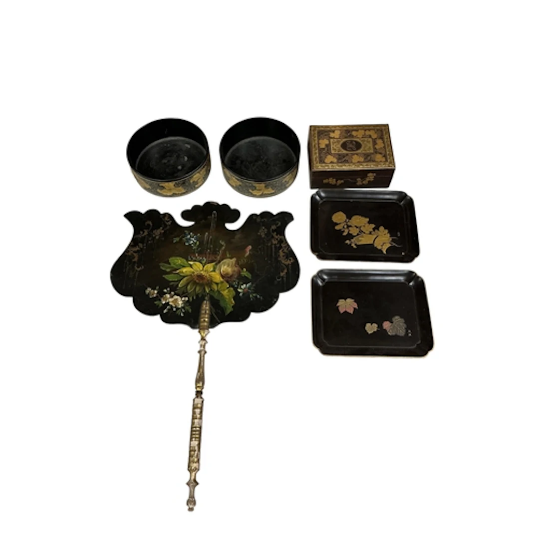 A pair of Regency gilt and black papier mache bottle coaster...