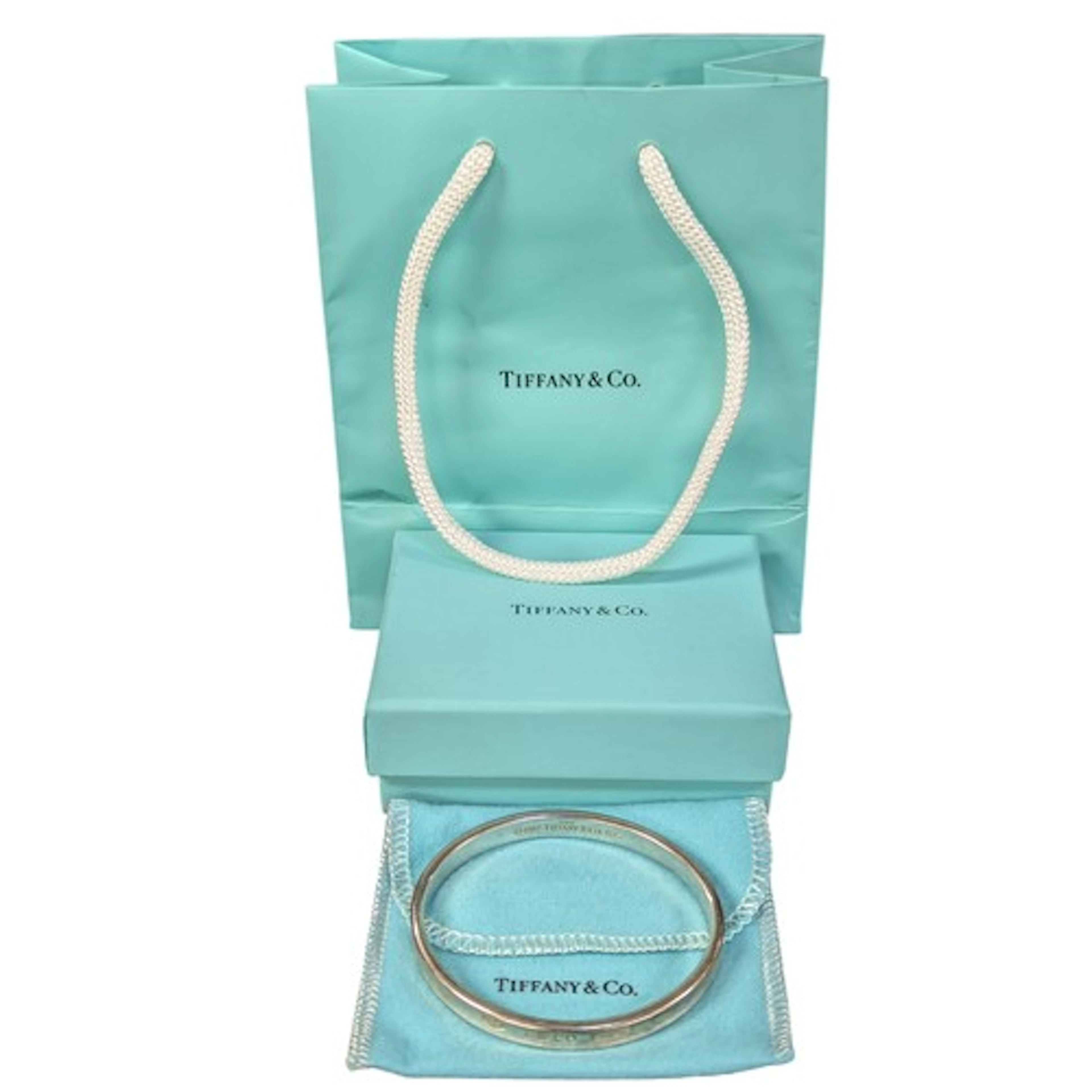Tiffany & Co - a silver concave bangle, 60mm inner diameter...