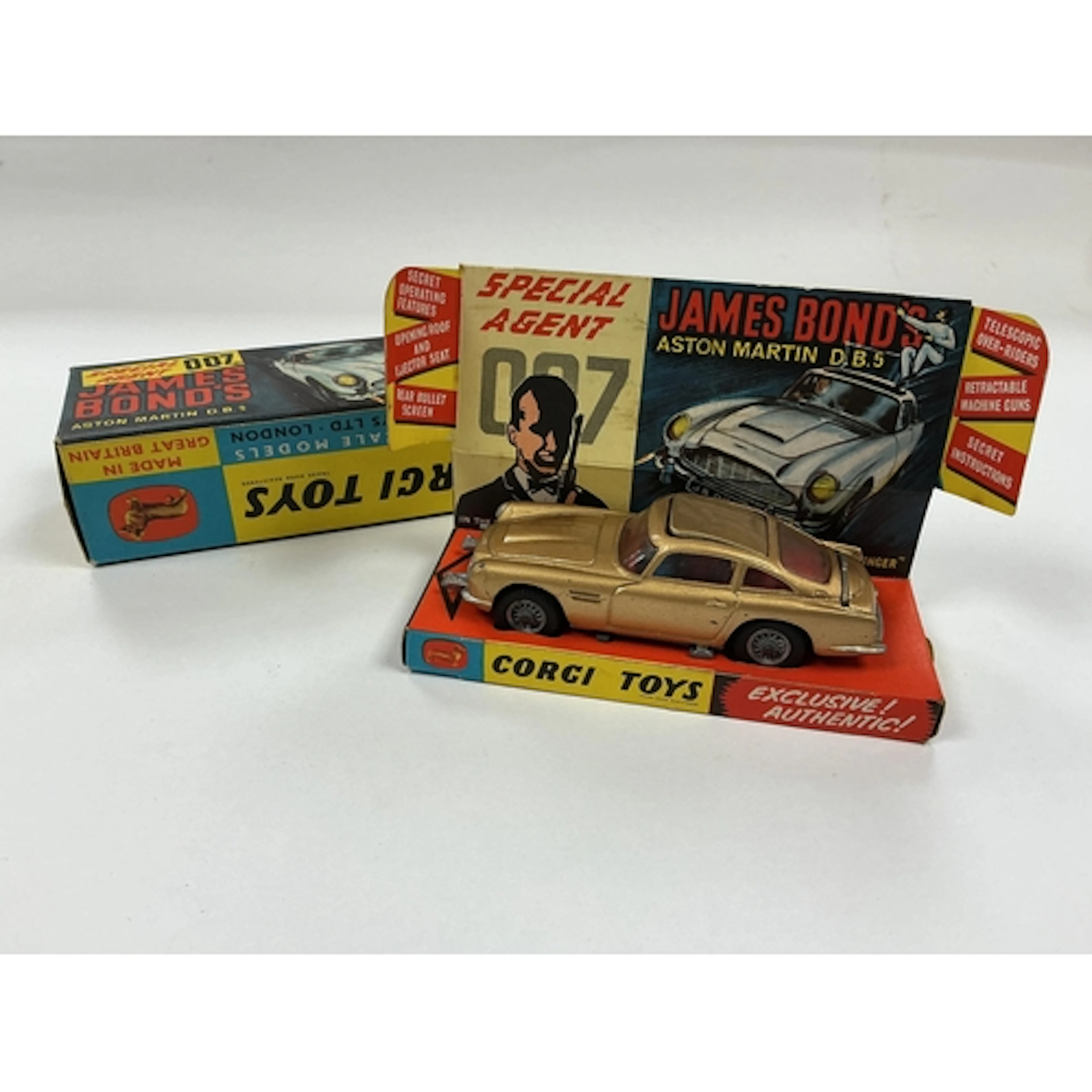 A boxed Corgi Toys James Bond 007 Aston Martin (261) in gold...