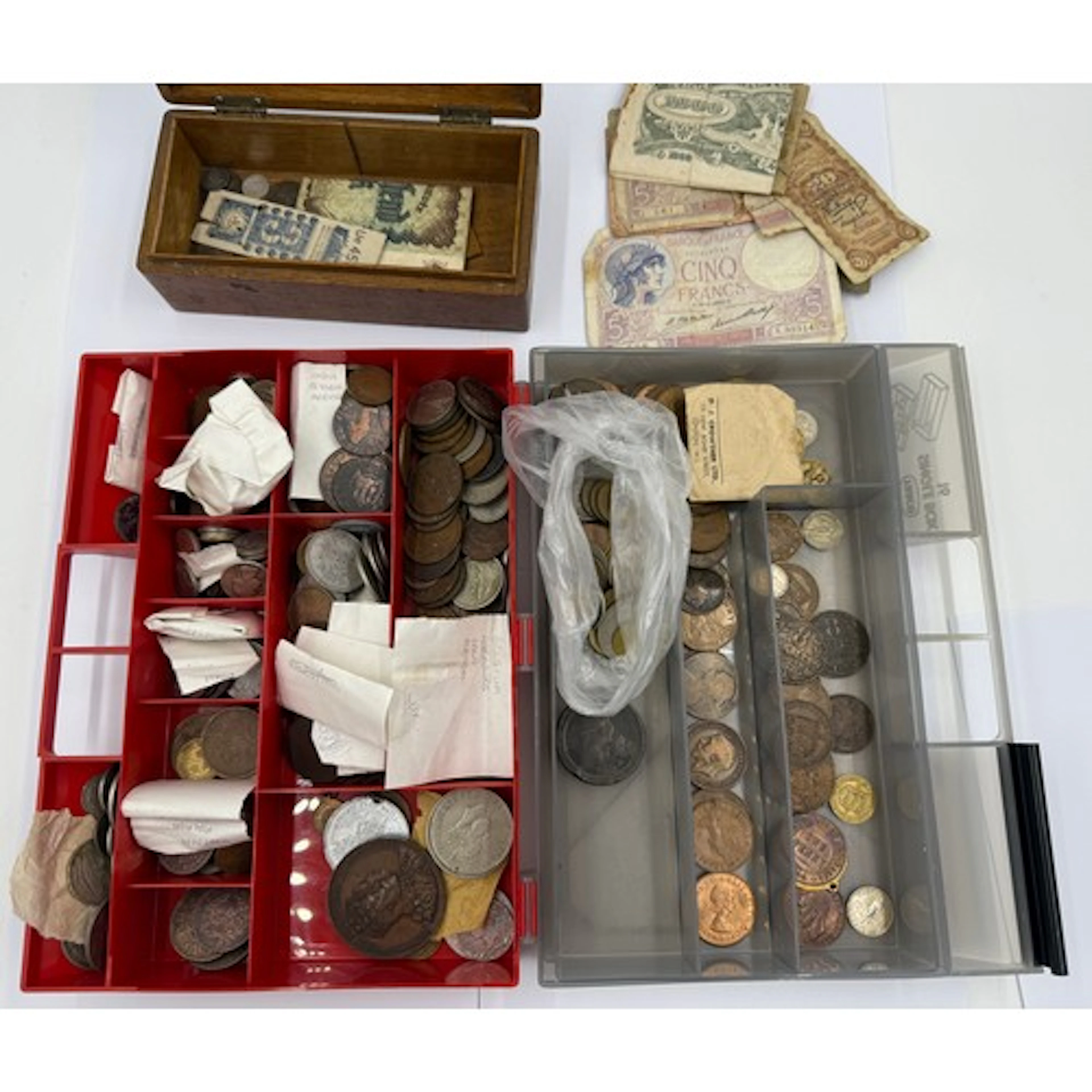 A large quantity of various world coins and banknotes to inc...