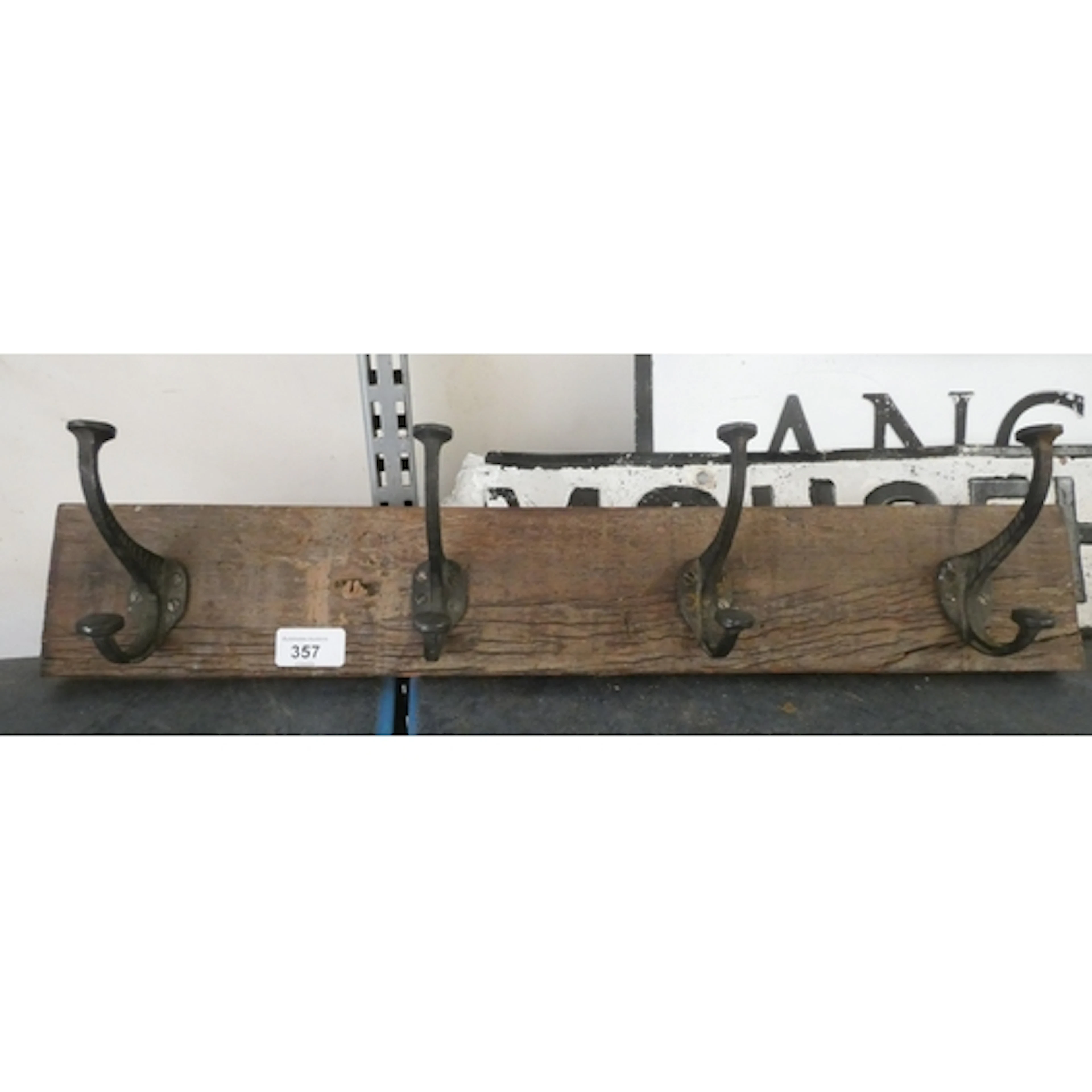 A vintage four hook wooden coat hook