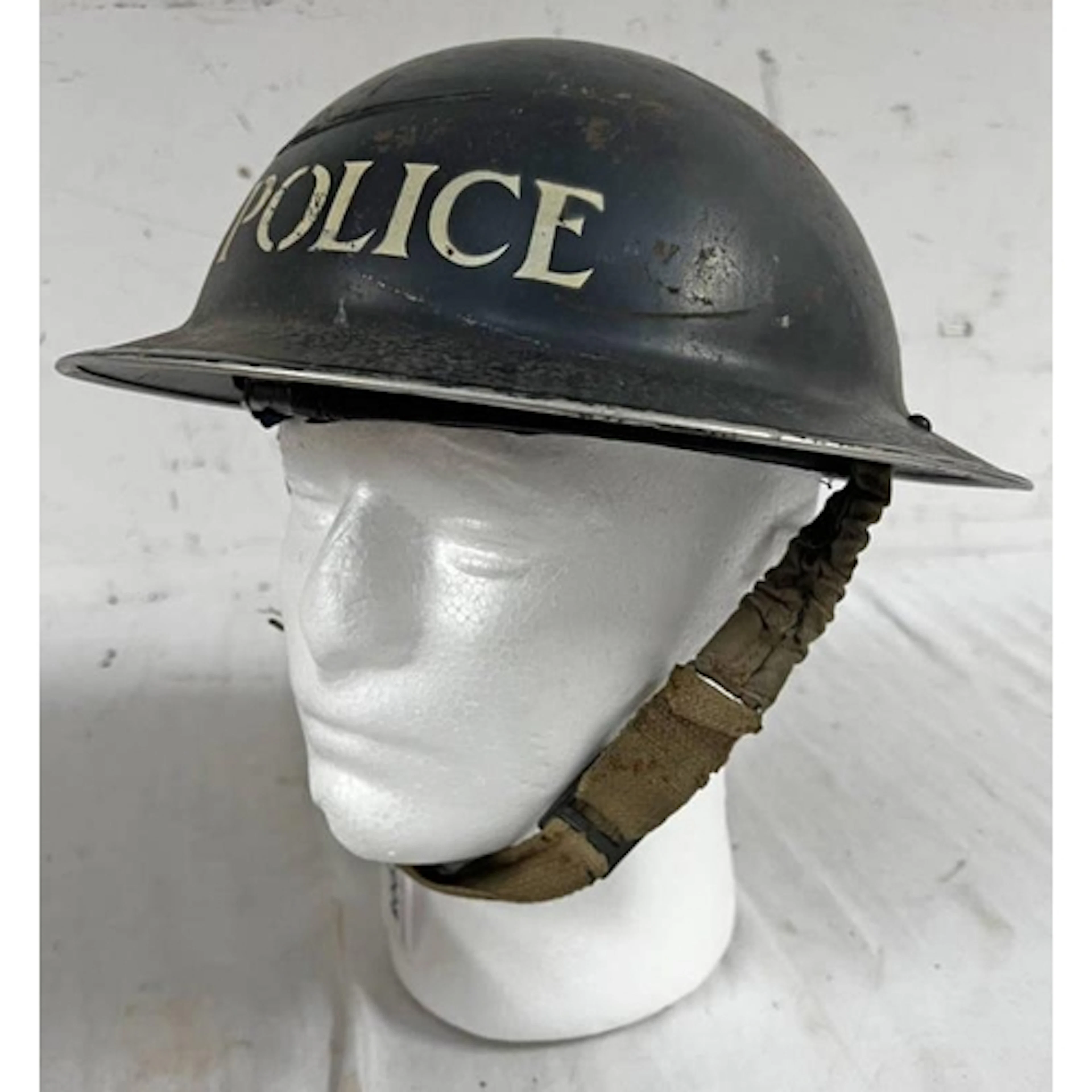 WW2 BRITISH BRODIE HELMET MARKED POLICE TO EXTERIOR AND STAM...