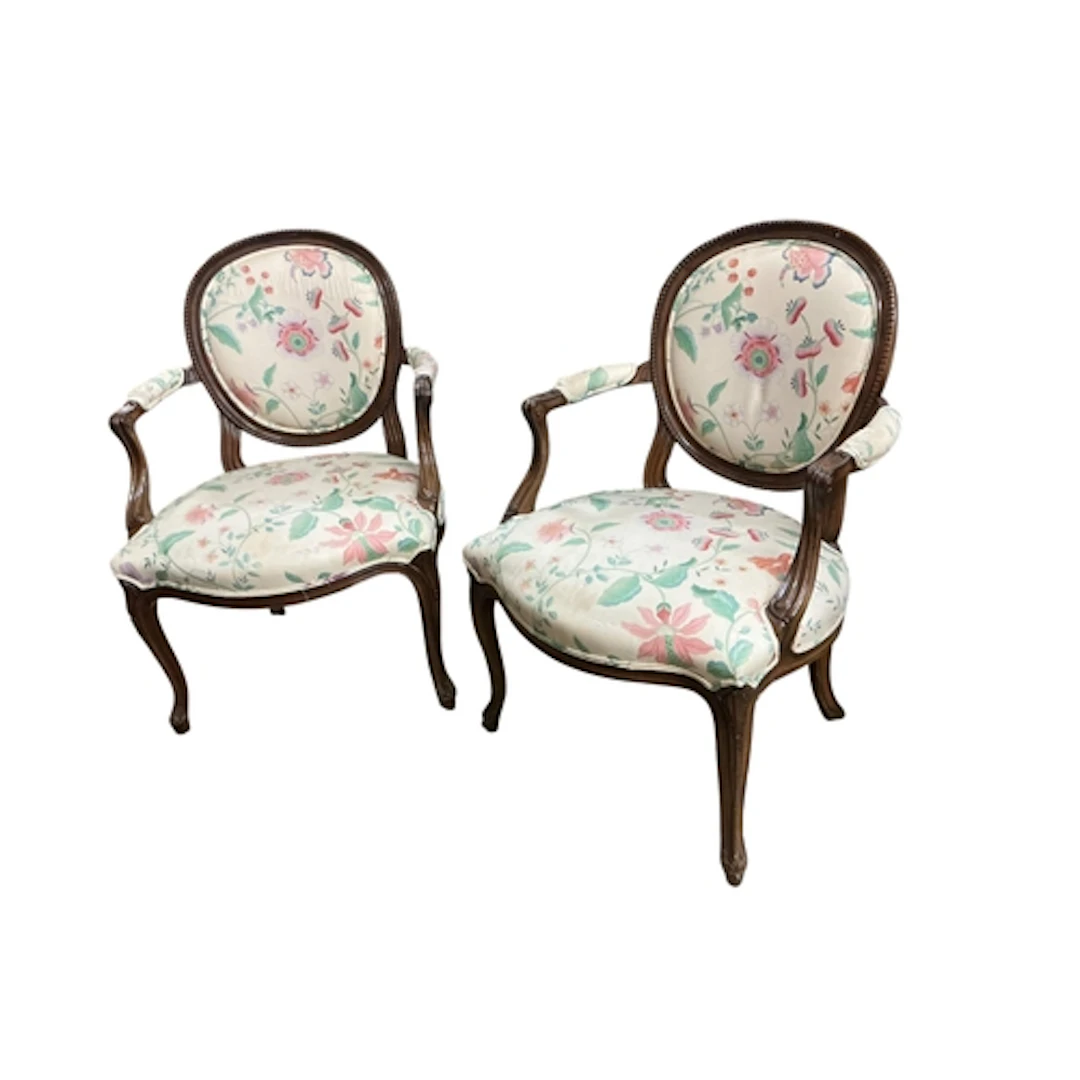 A pair of reproduction mahogany elbow chairs, width 62cm, de...
