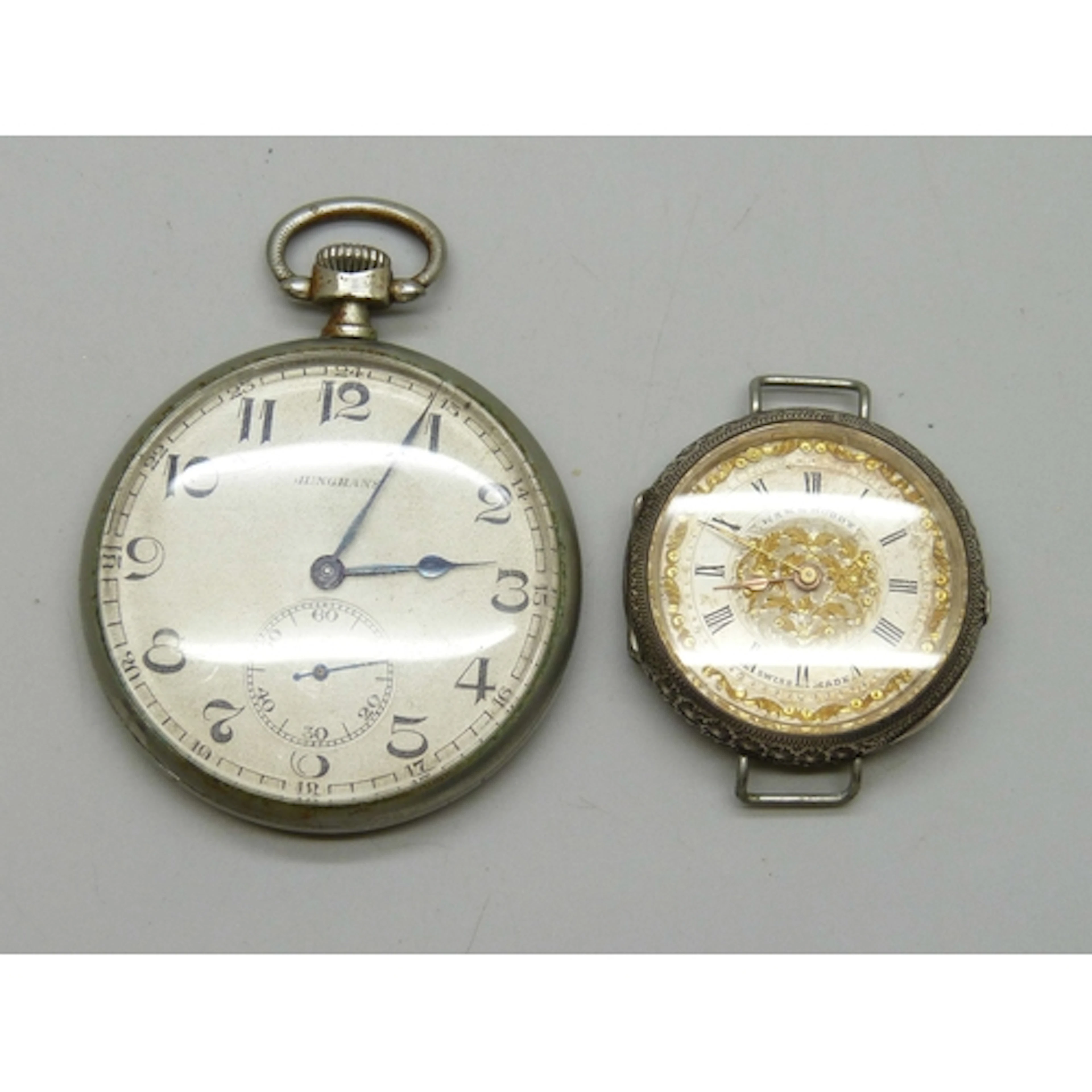 A Junghans pocket watch, and a lady's .935 silver wristwatch...