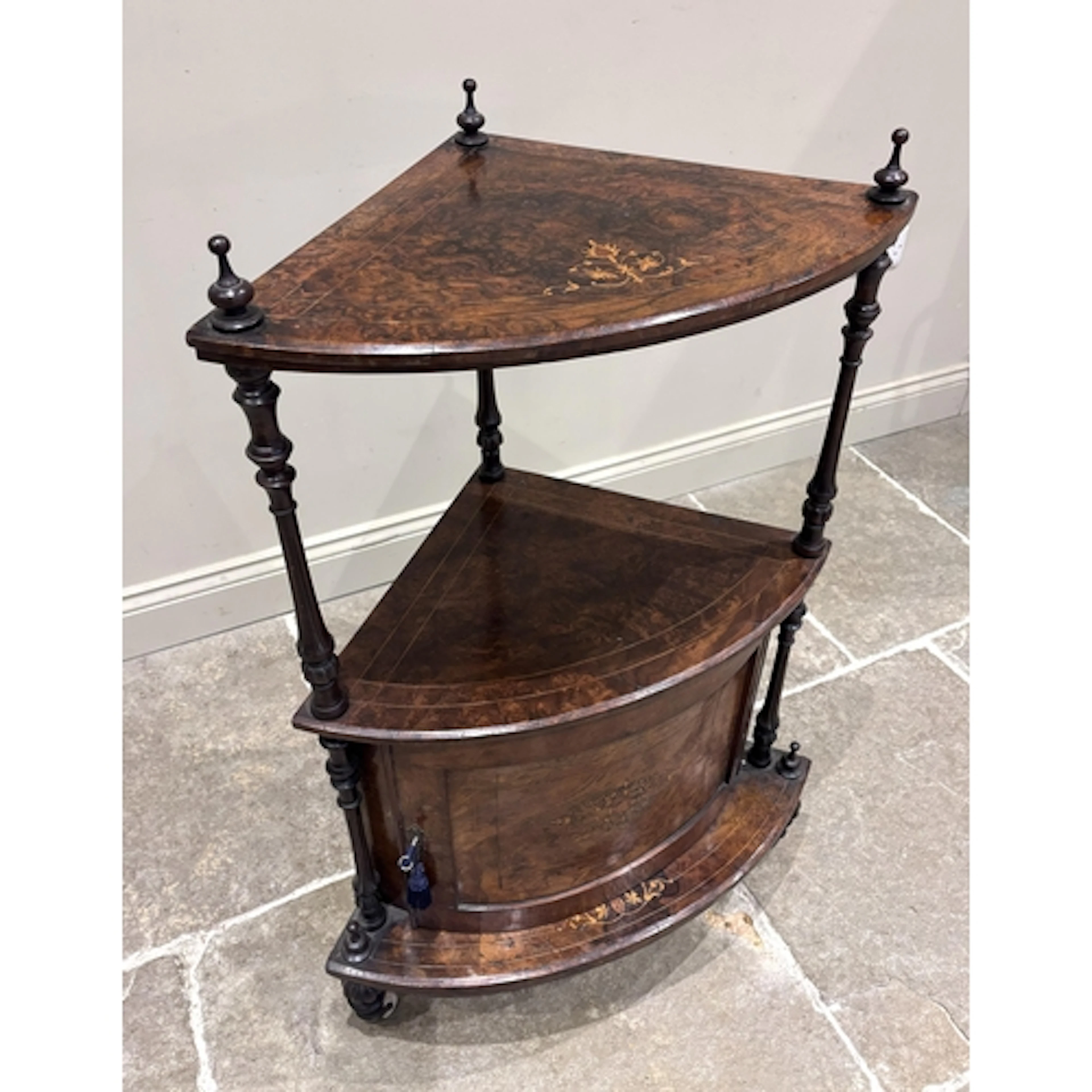 A Victorian burr walnut corner whatnot or etagere, the bow f...
