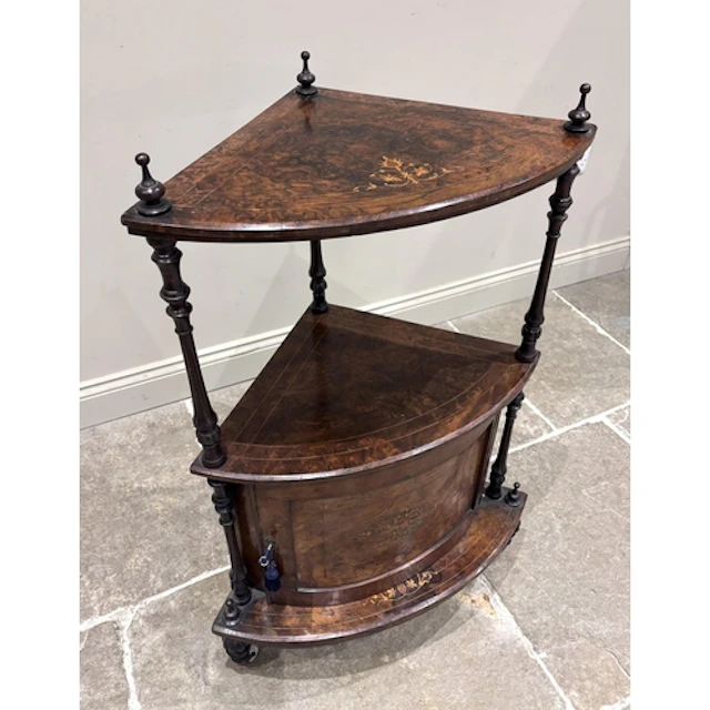 A Victorian burr walnut corner whatnot or etagere, the bow f...