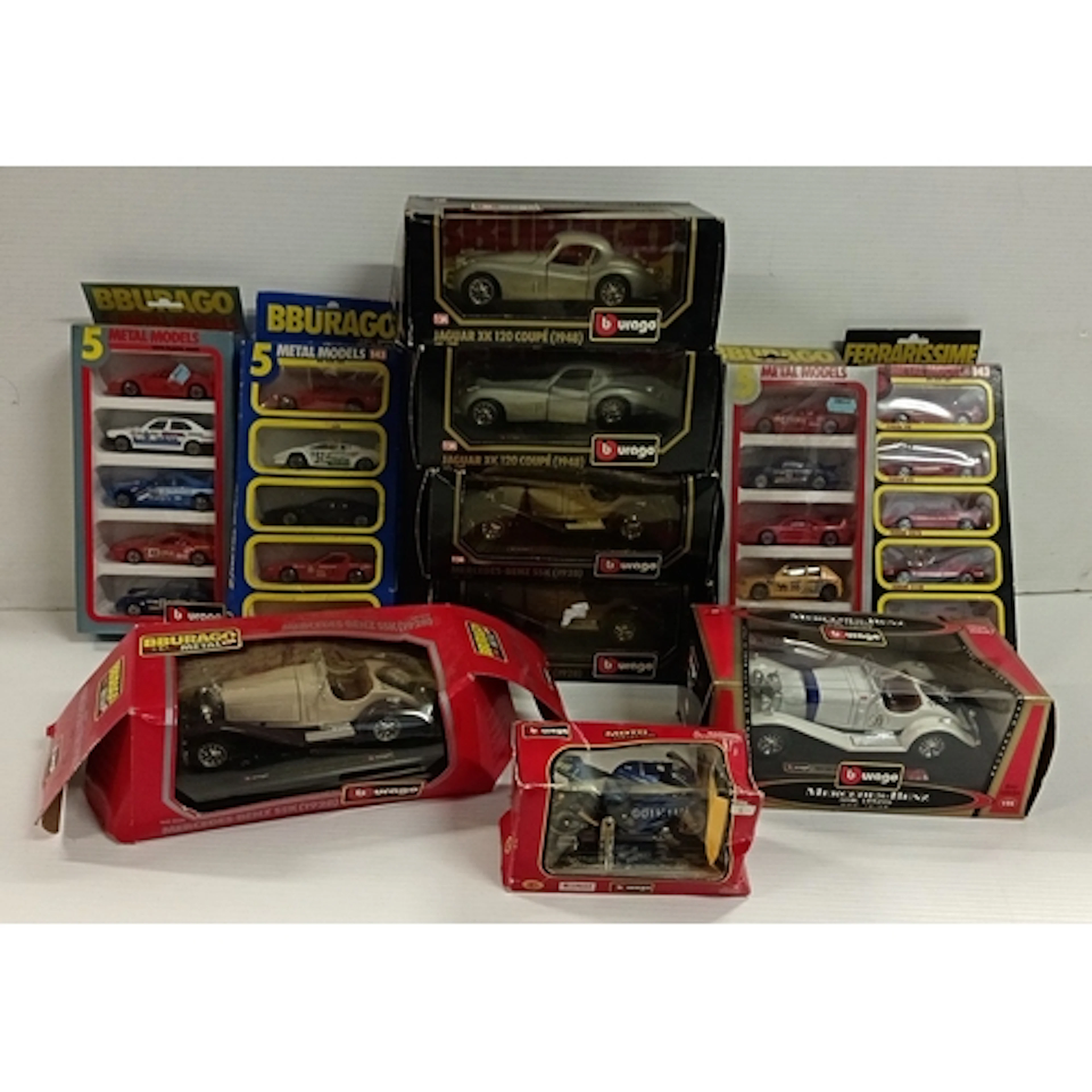 Lot of boxed Bburago die-cast model vehicles and Moto collec...