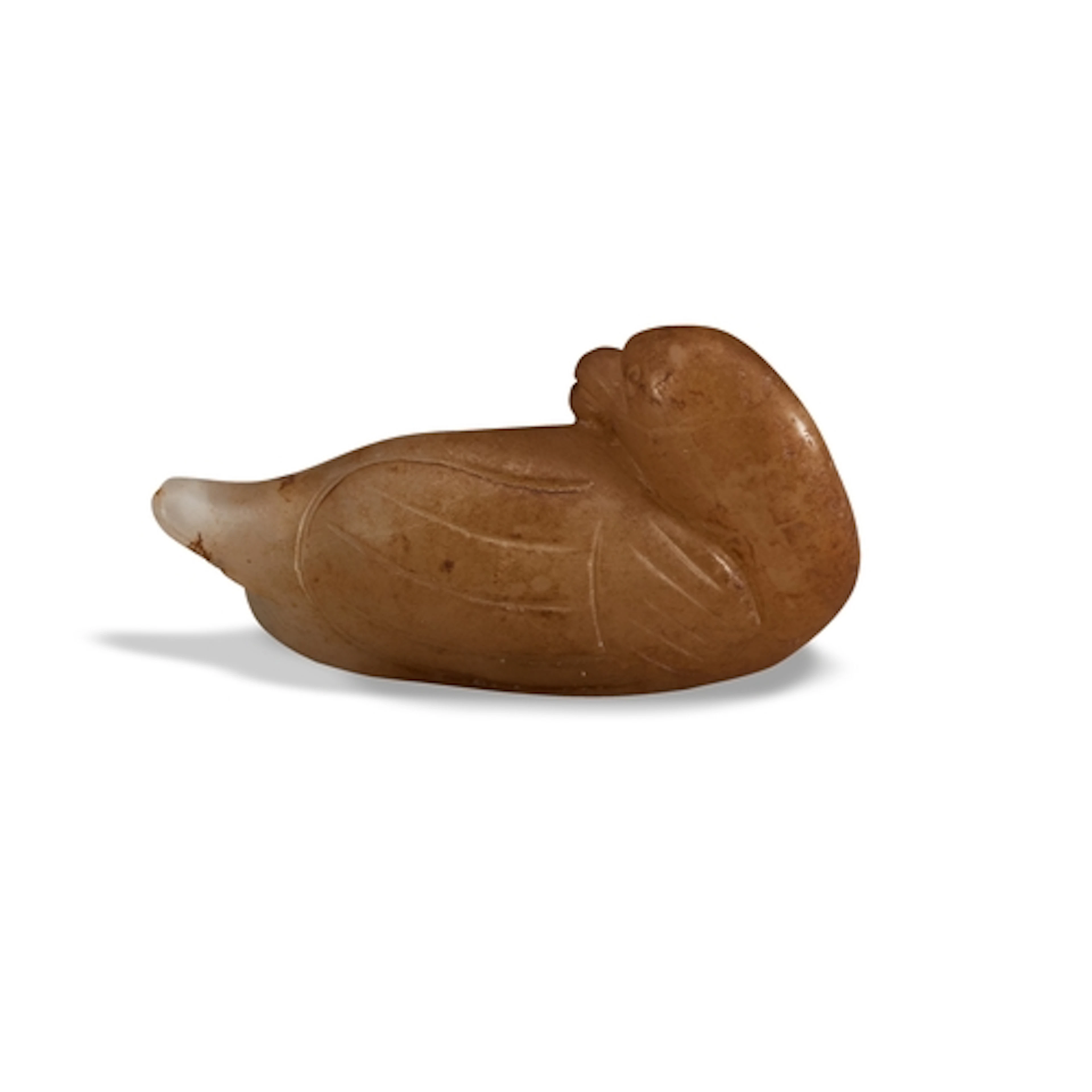 A YELLOW AND BROWN RUSSET JADE OF A BIRD QING DYNASTY, 19TH...