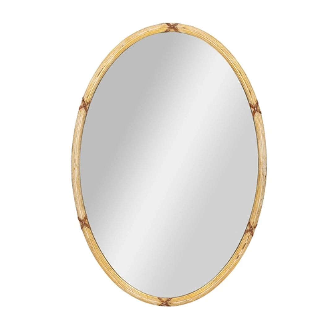 A giltwood framed oval wall mirror in Regency taste, the ree...
