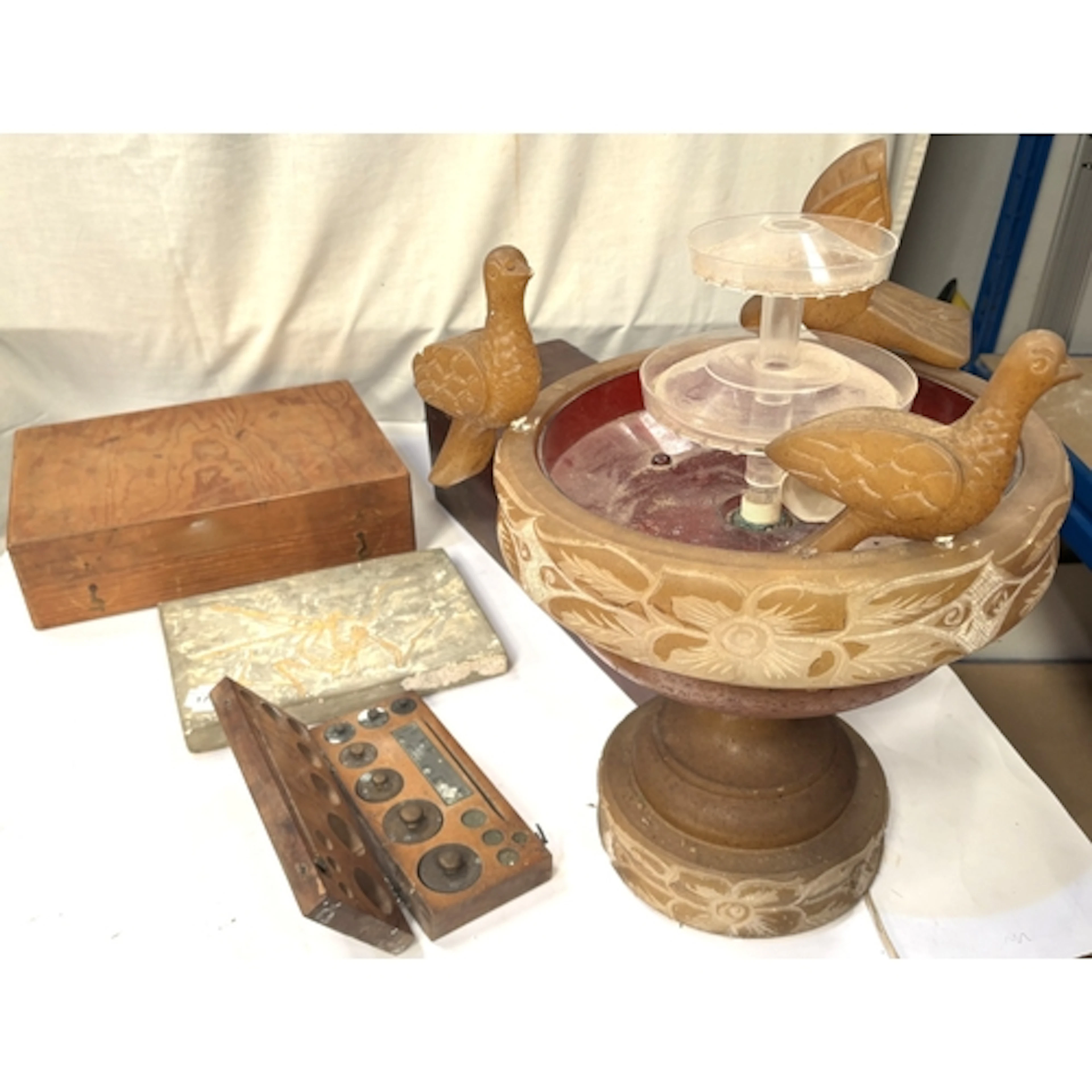 A replica Pterosaur fossil, a mahogany till, part set of pre...