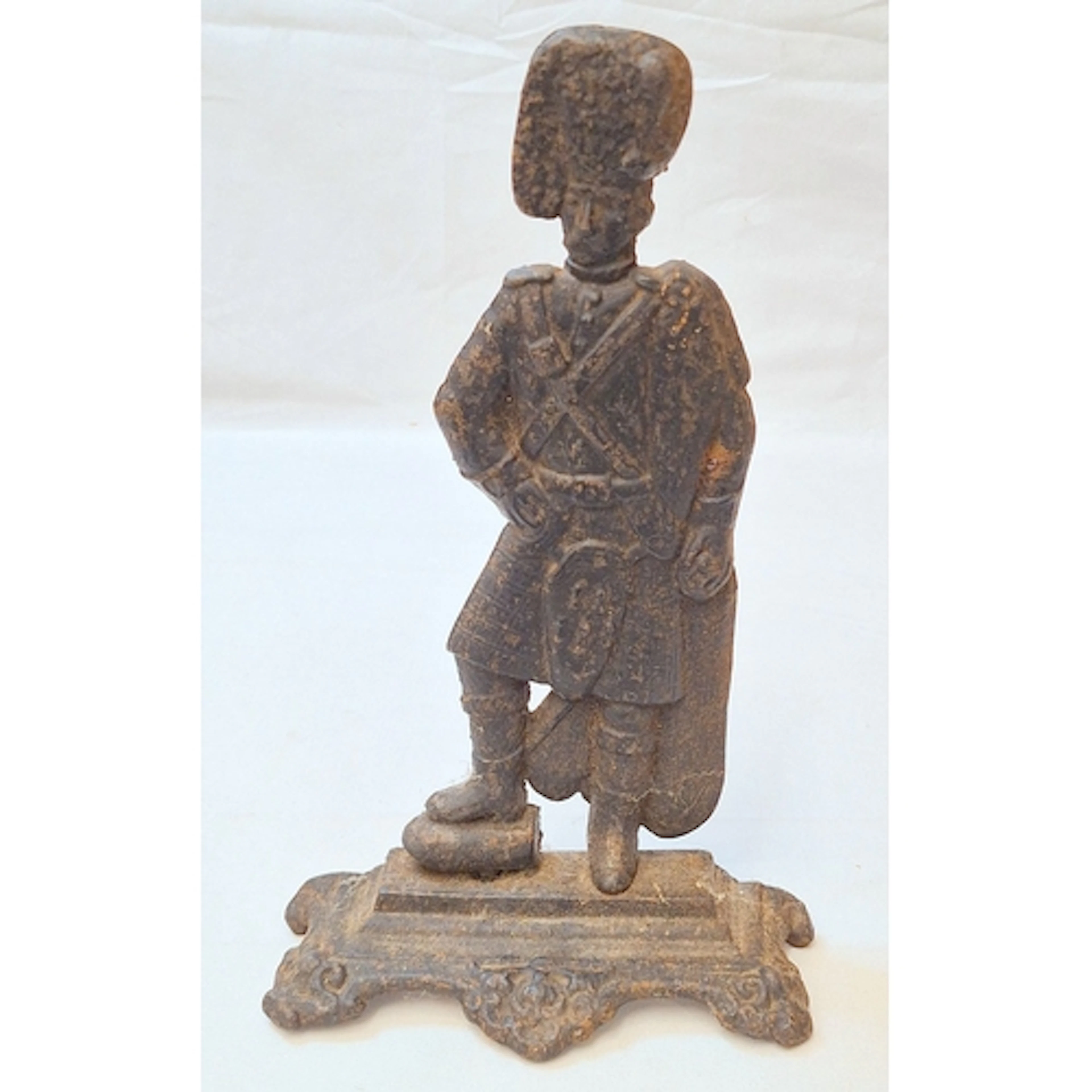 Vintage Cast Metal Door Stop depicting a Scottish highlander...