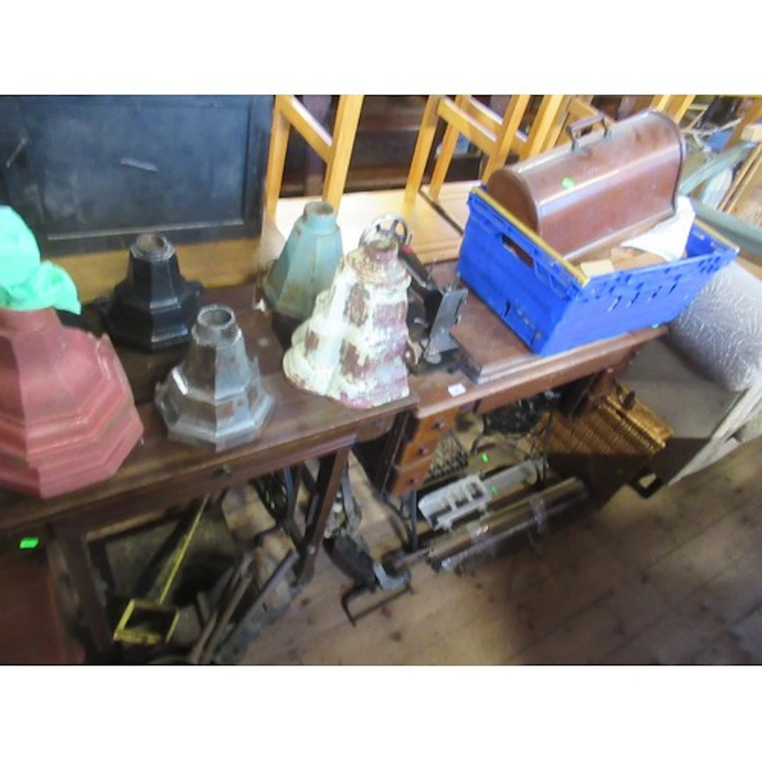 Two treadle sewing machines af together with various tools, ...