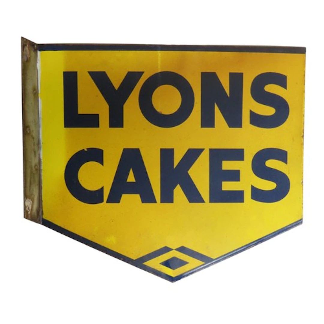 A 'LYON'S CAKES' DOUBLE SIDED PROJECTING ENAMEL SIGN of shie...