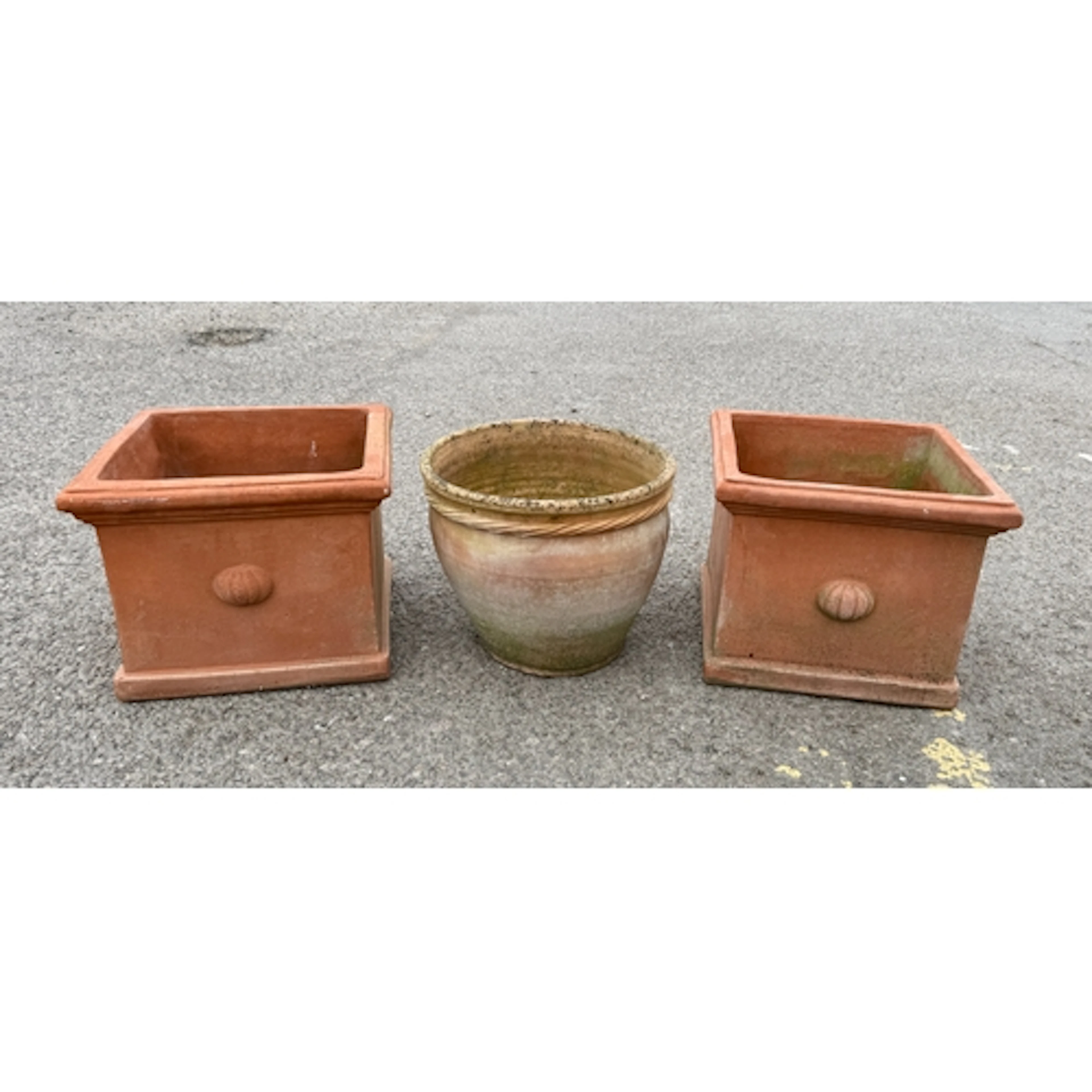A pair of square terracotta garden planters - with relief pu...