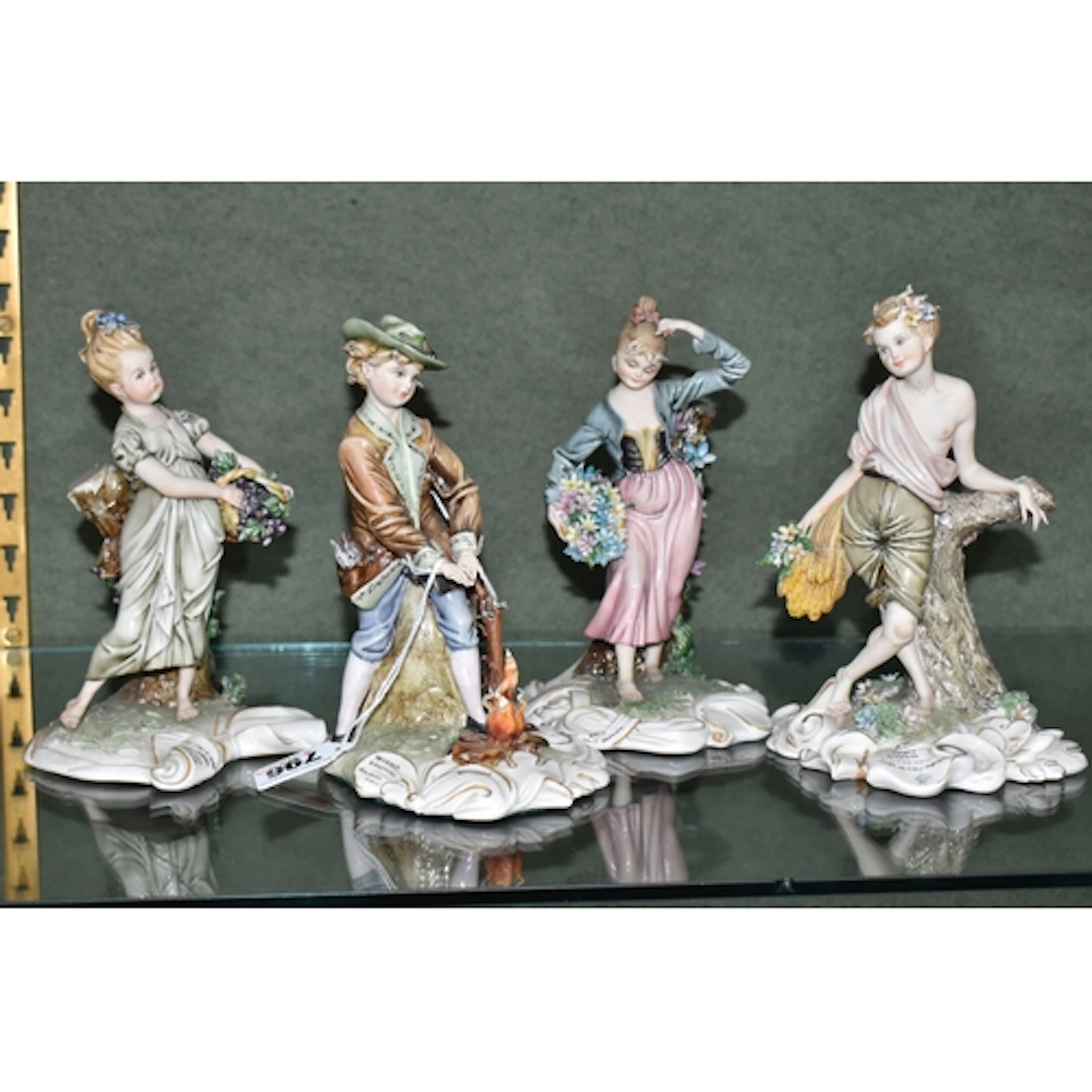A SET OF CAPODIMONTE 'FOUR SEASONS' FIGURES BY TIZIANO GALLI...