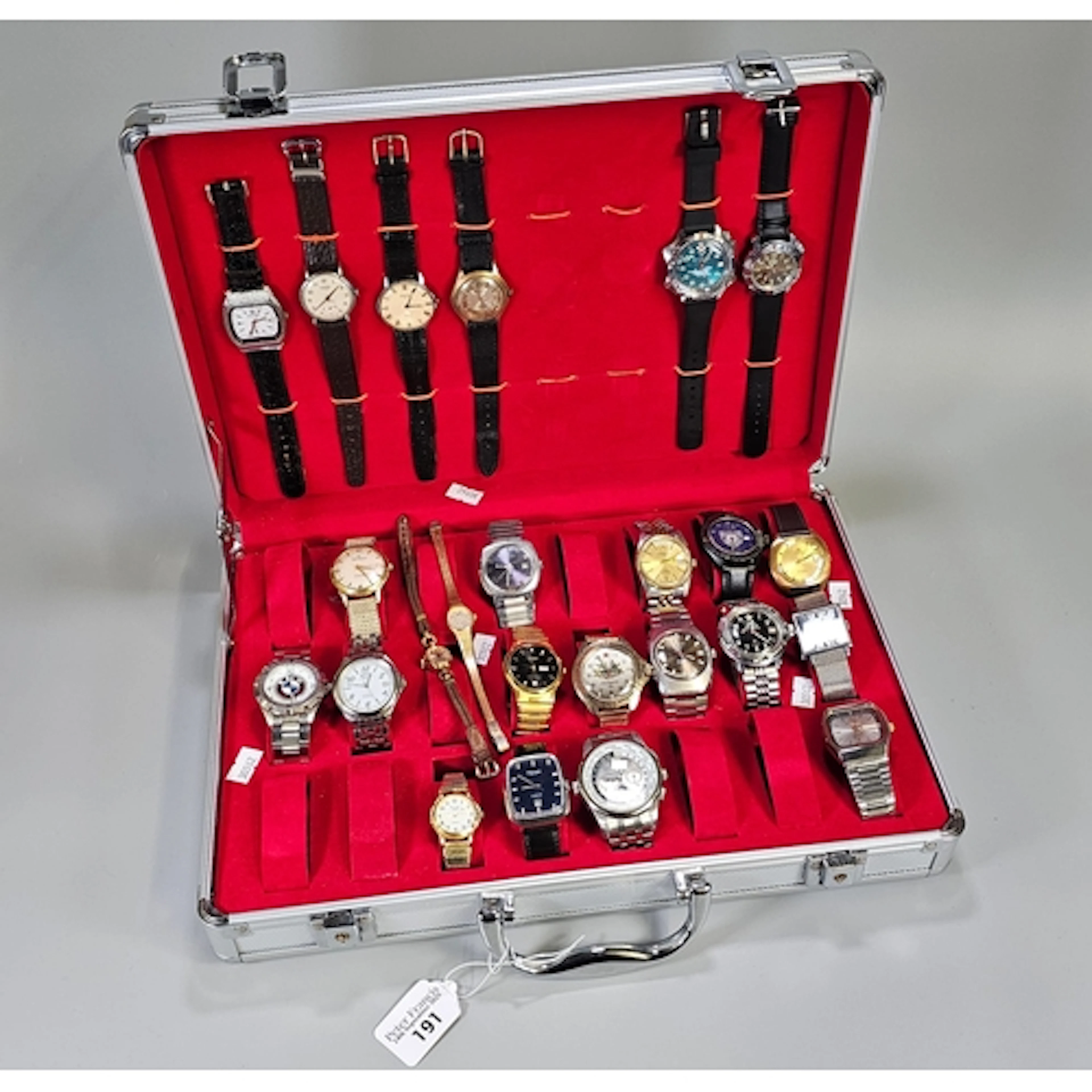An aluminium flight case type watch box containing a varied ...