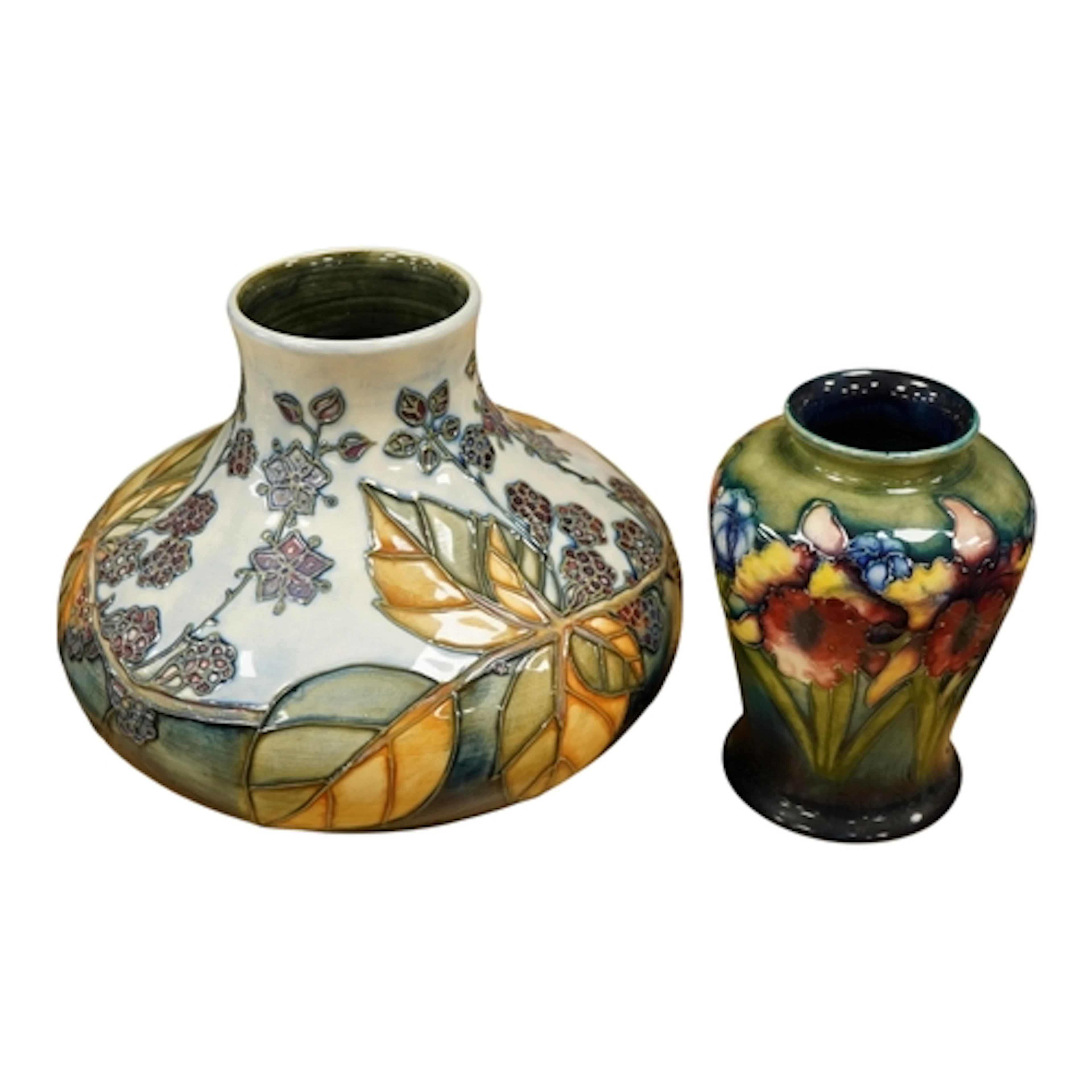 A Moorcroft pottery tube lined 'Bramble' patterned squat vas...
