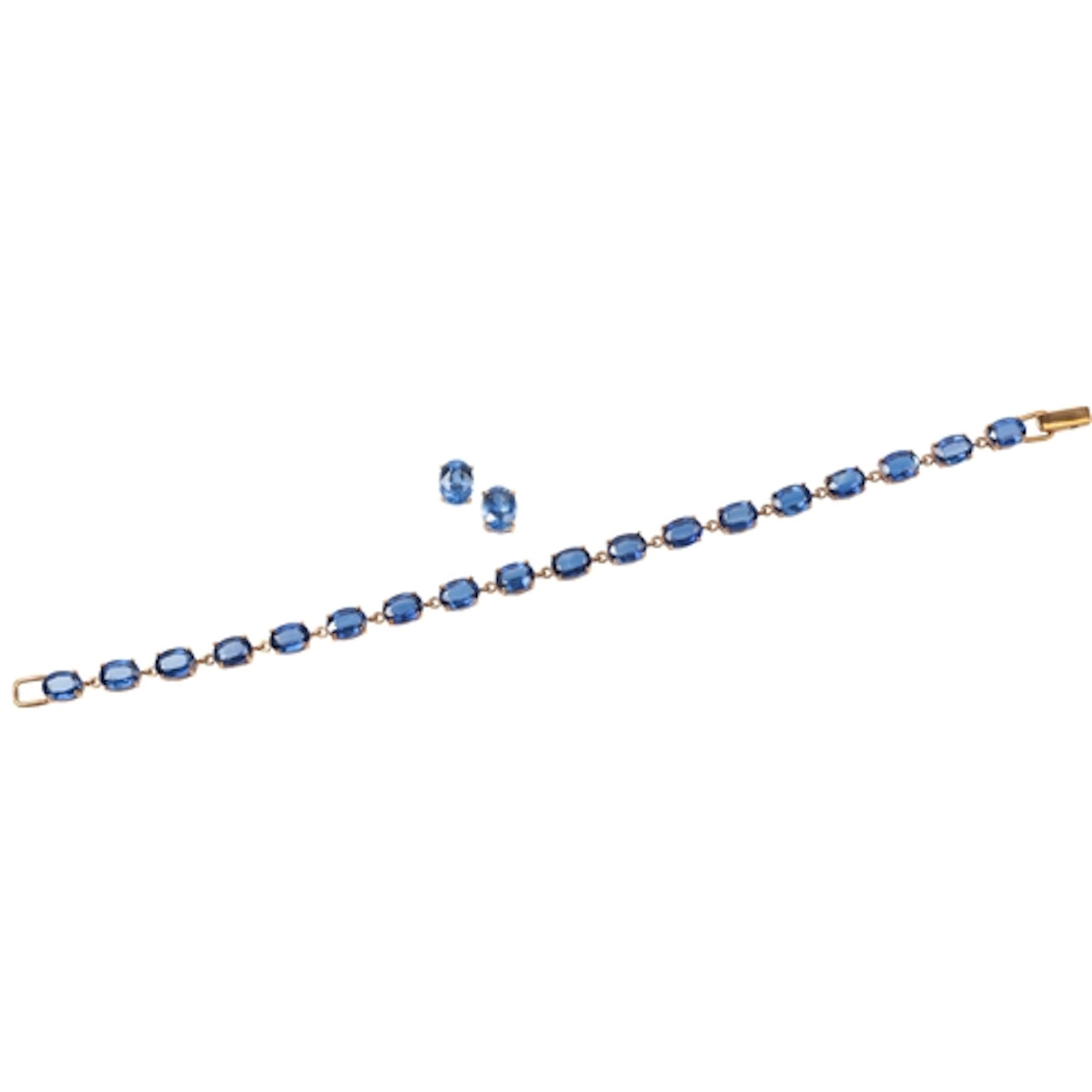 A kyanite demi-parure, comprising: a line bracelet set with ...