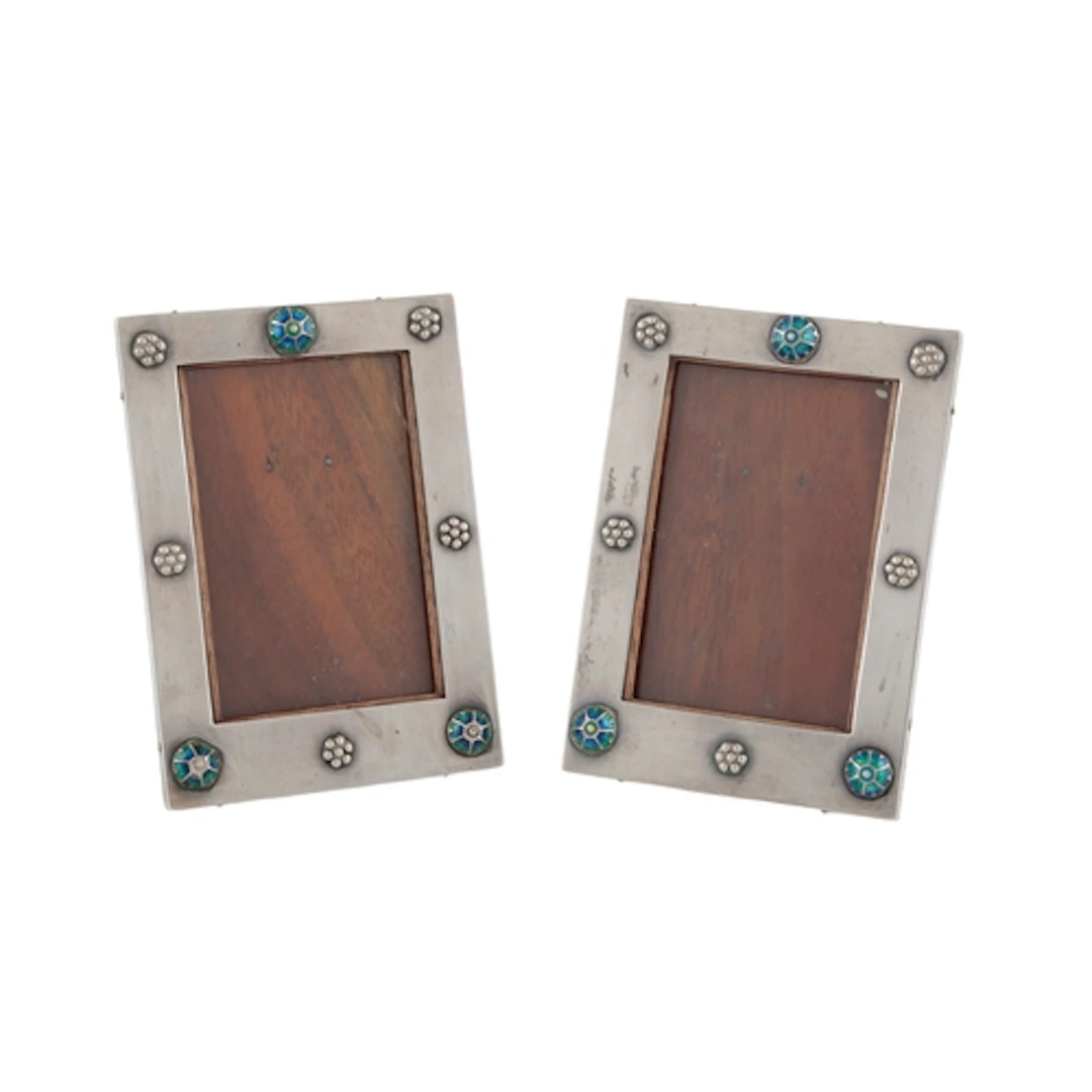A pair of George V Arts & Crafts Liberty & Co silver and ena...