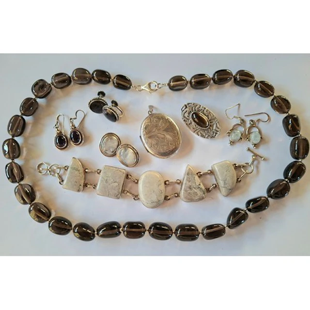 A quantity of silver jewellery comprising a polished smoky q...