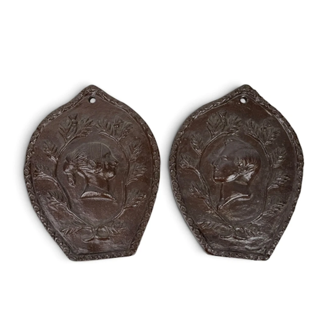 A PAIR OF SALT-GLAZED STONEWARE PLAQUES DEPICTING QUEEN VICT...