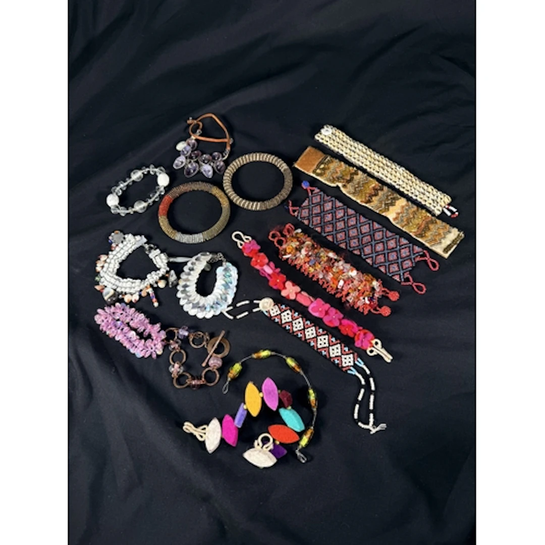 Two African style beadwork roll bangles; a Lee Angel multi s...