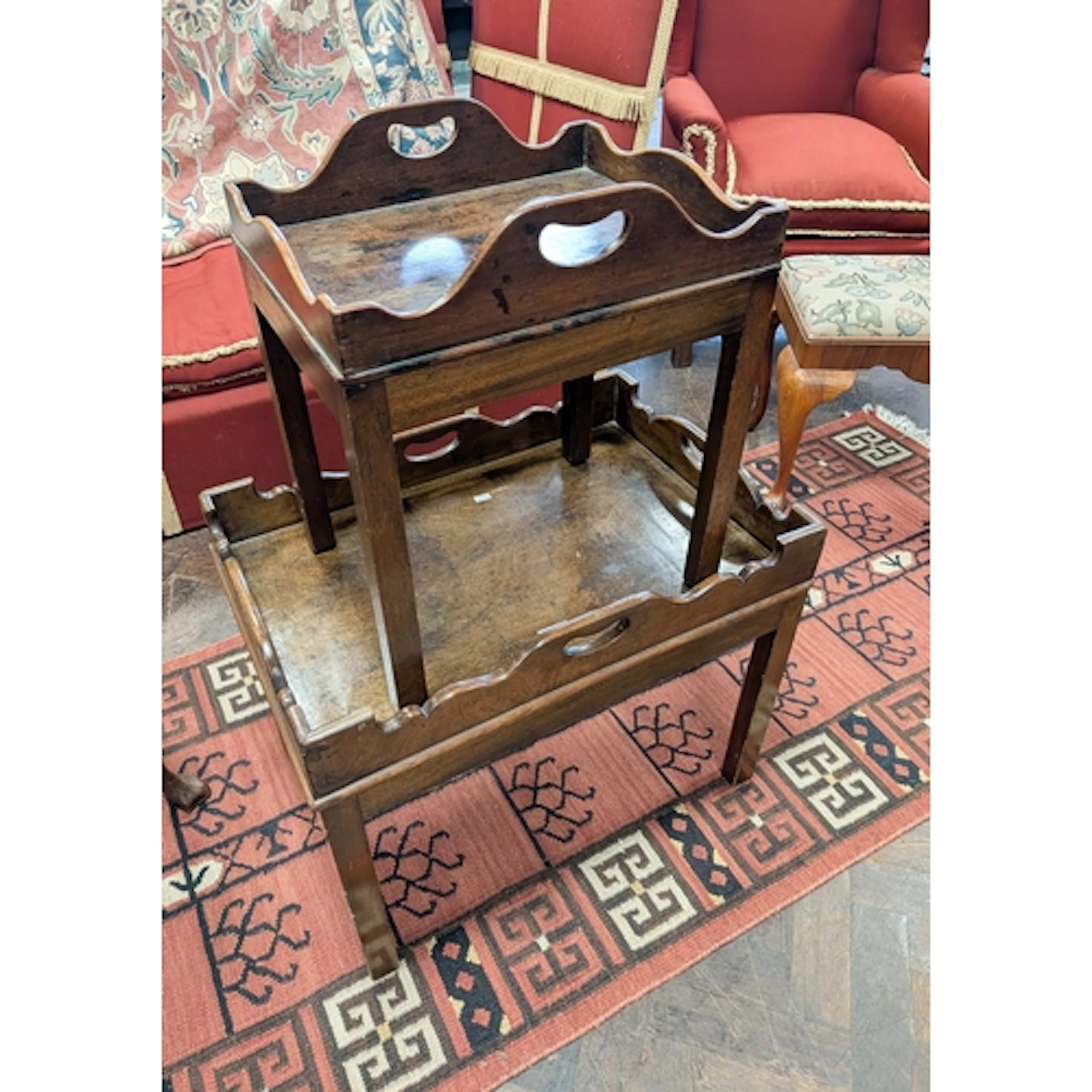 Two low antique mahogany framed tray topped tea tables