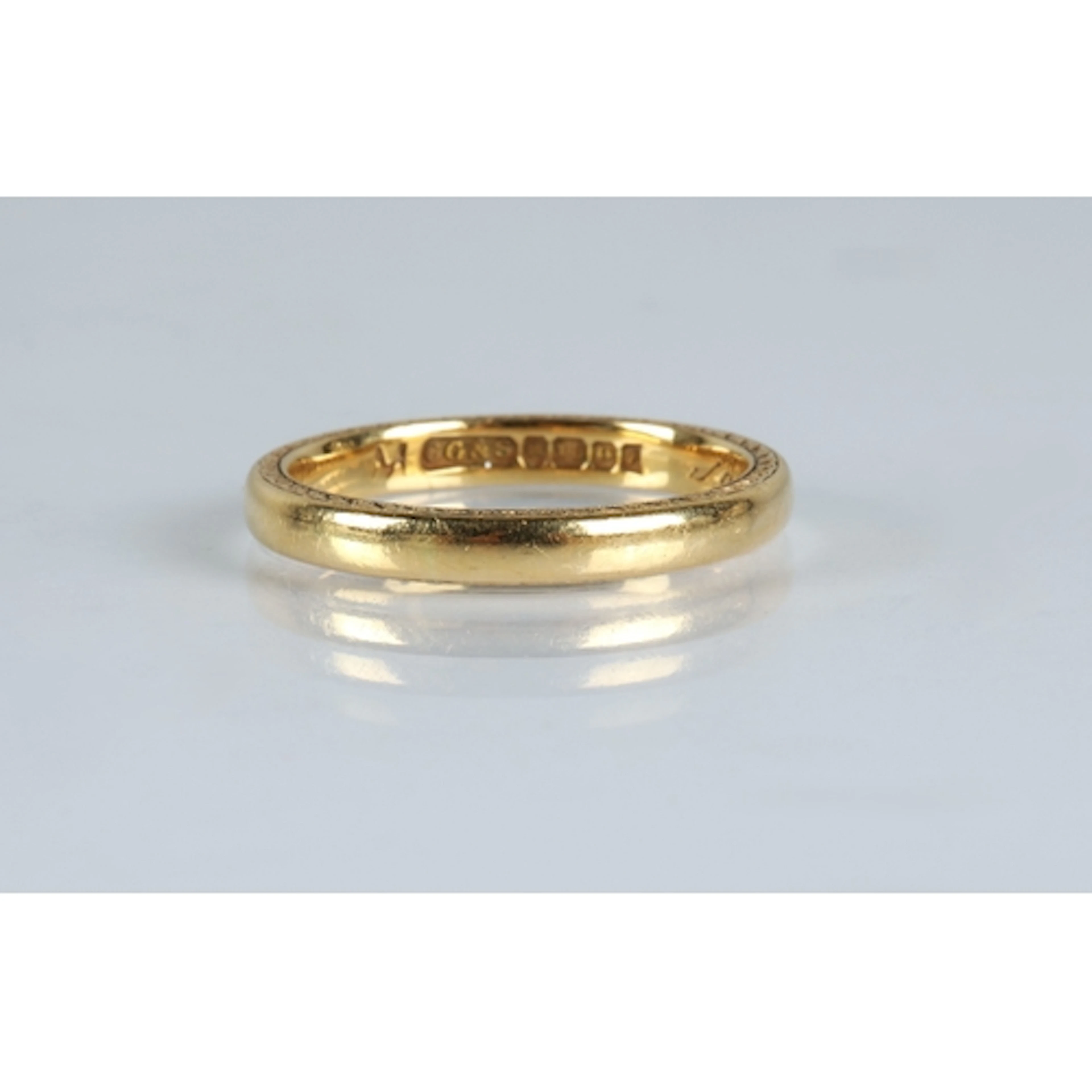 18ct gold wedding band the edges with engraved pattern, by C...
