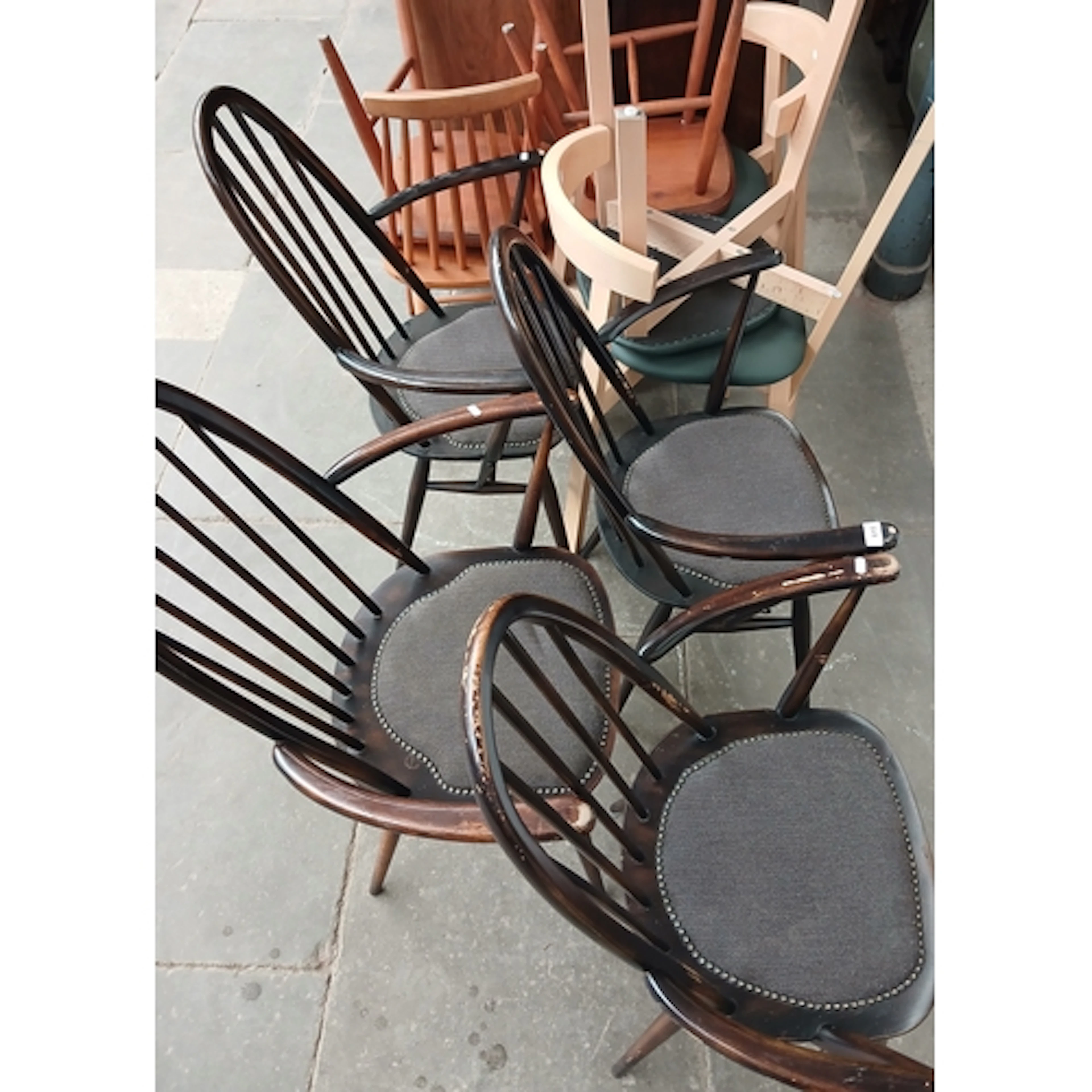 A set of four Ercol chairs and six others.