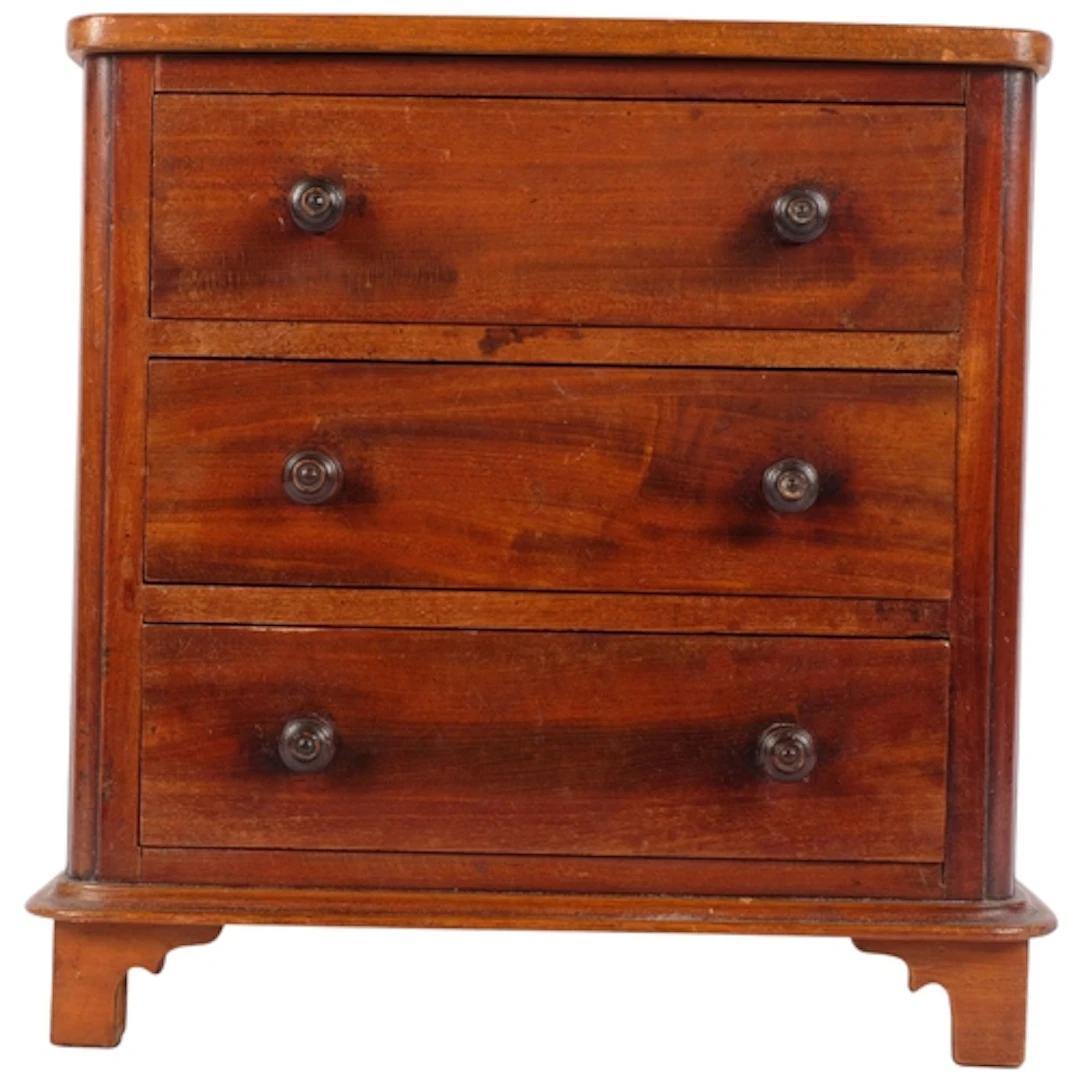 A small Victorian mahogany table-top chest of 3 long drawers...