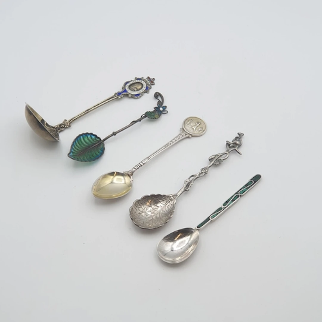 A white metal Plique à Jour Spoon with floral finial possibl...