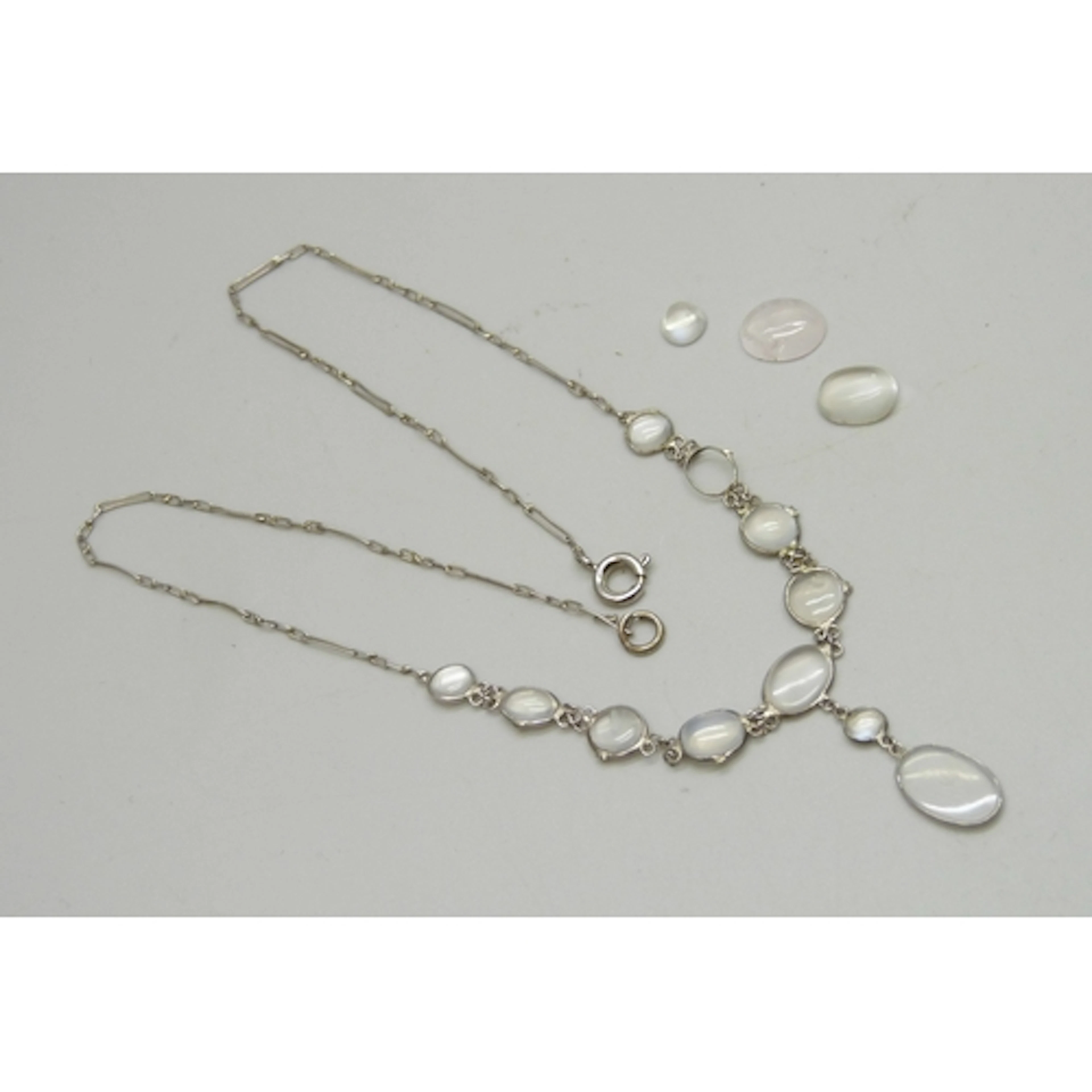 A late 19th/early 20th century white metal set moonstone dro...